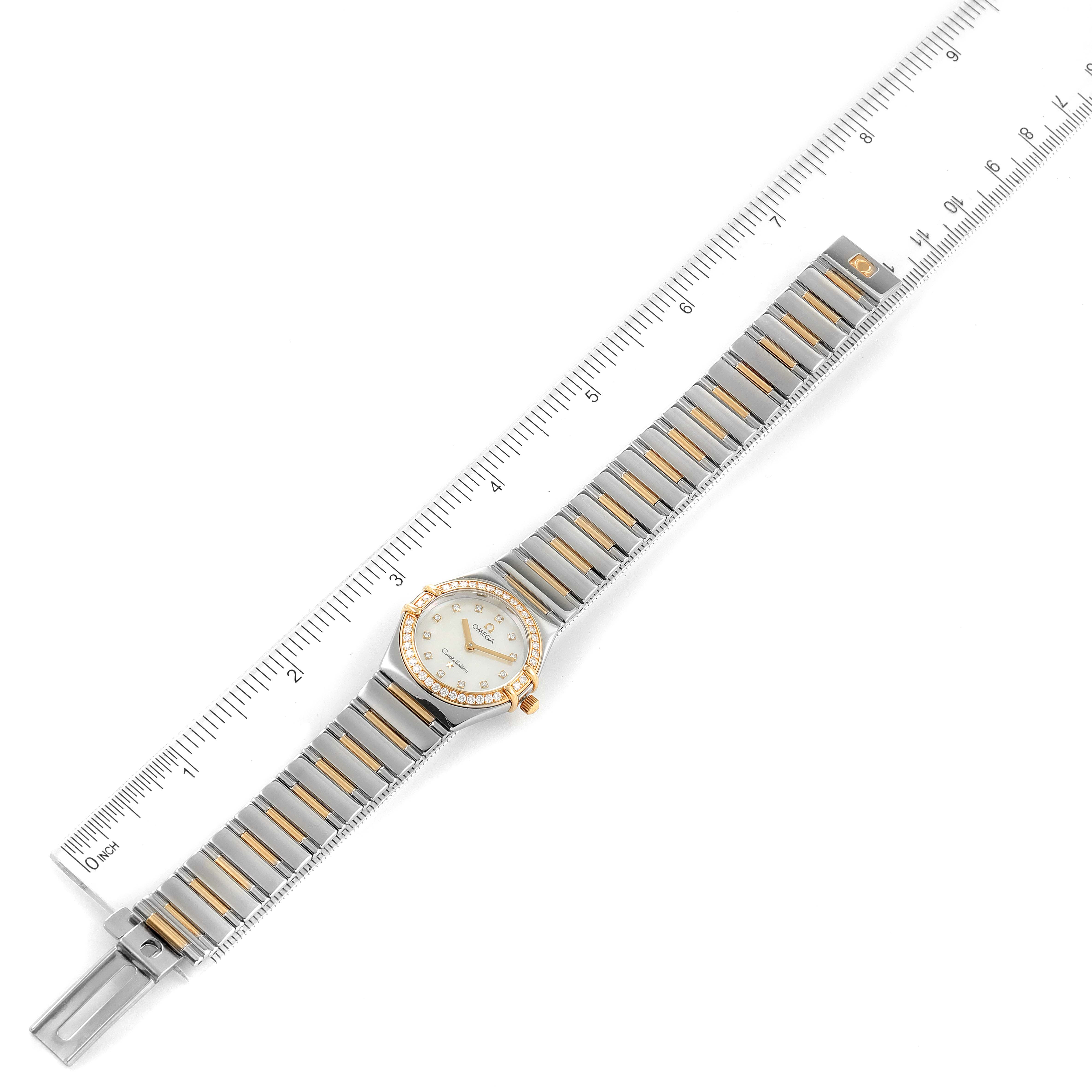 The Omega Women's Steel and Gold (two tone) Mother of Pearl Dial Women's Steel and Gold (two tone) Mother of Pearl Dial Constellation My Choice Steel 18k Rose Gold Diamond Ladies Watch is shown flat with a ruler for scale.