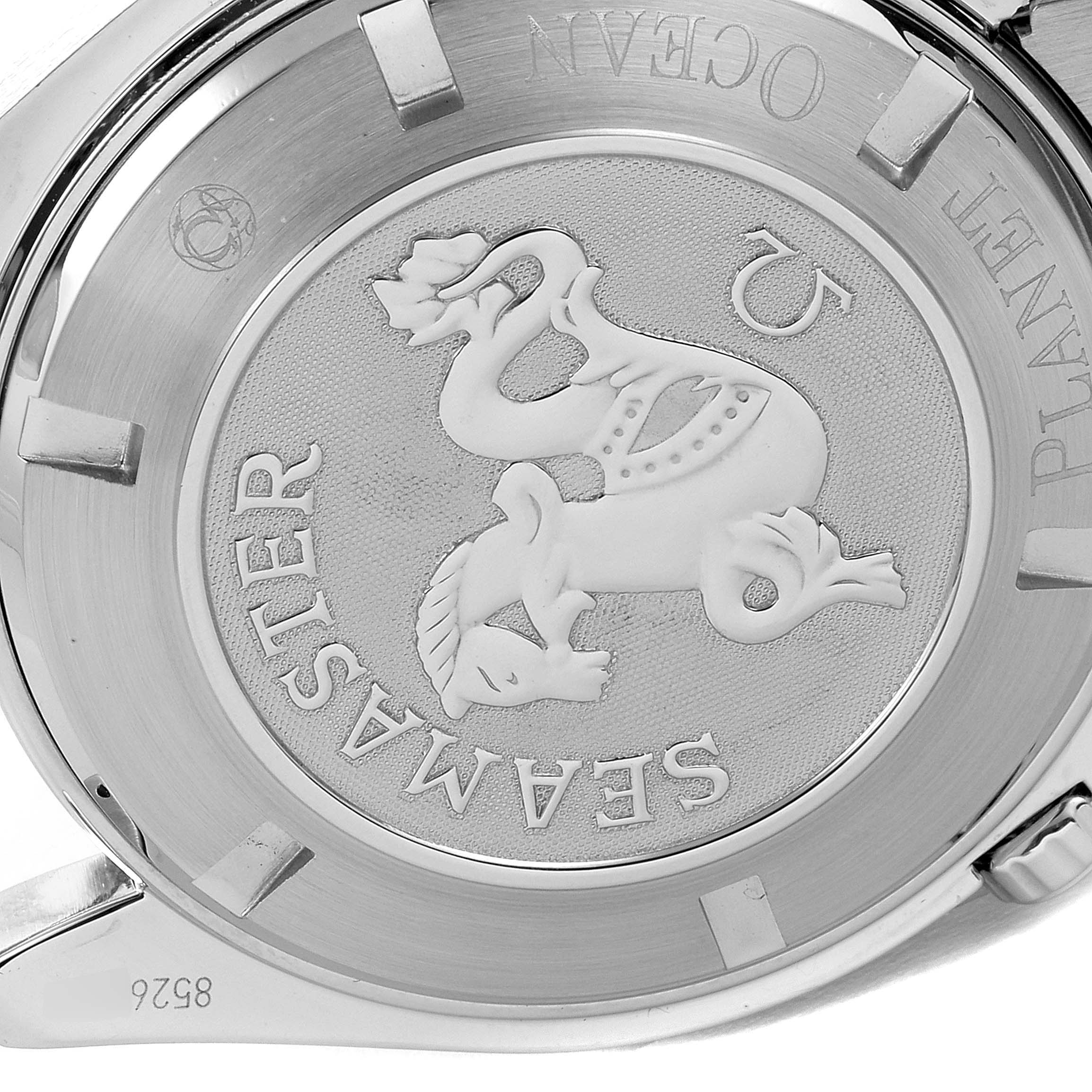 The image shows the case back of the Planet Ocean model by Omega, detailing the Seamaster emblem.