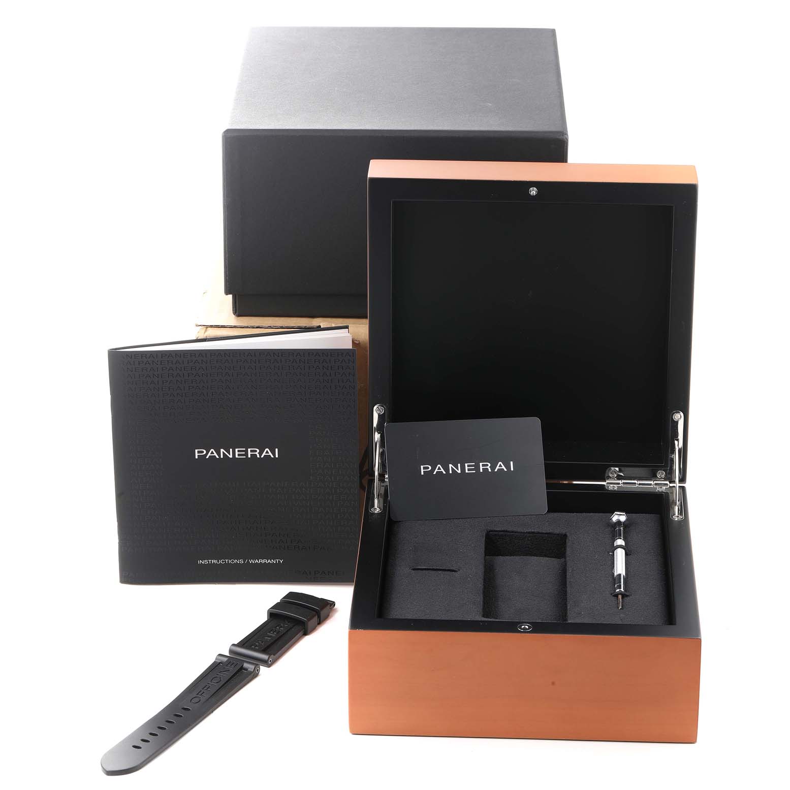 The image shows the box, a strap, a booklet, and a tool for the Panerai Luminor PAM00560 Men
s Stainless Steel Black Dial PAM00560 Men
s Stainless Steel Black Dial watch, viewed from the front.