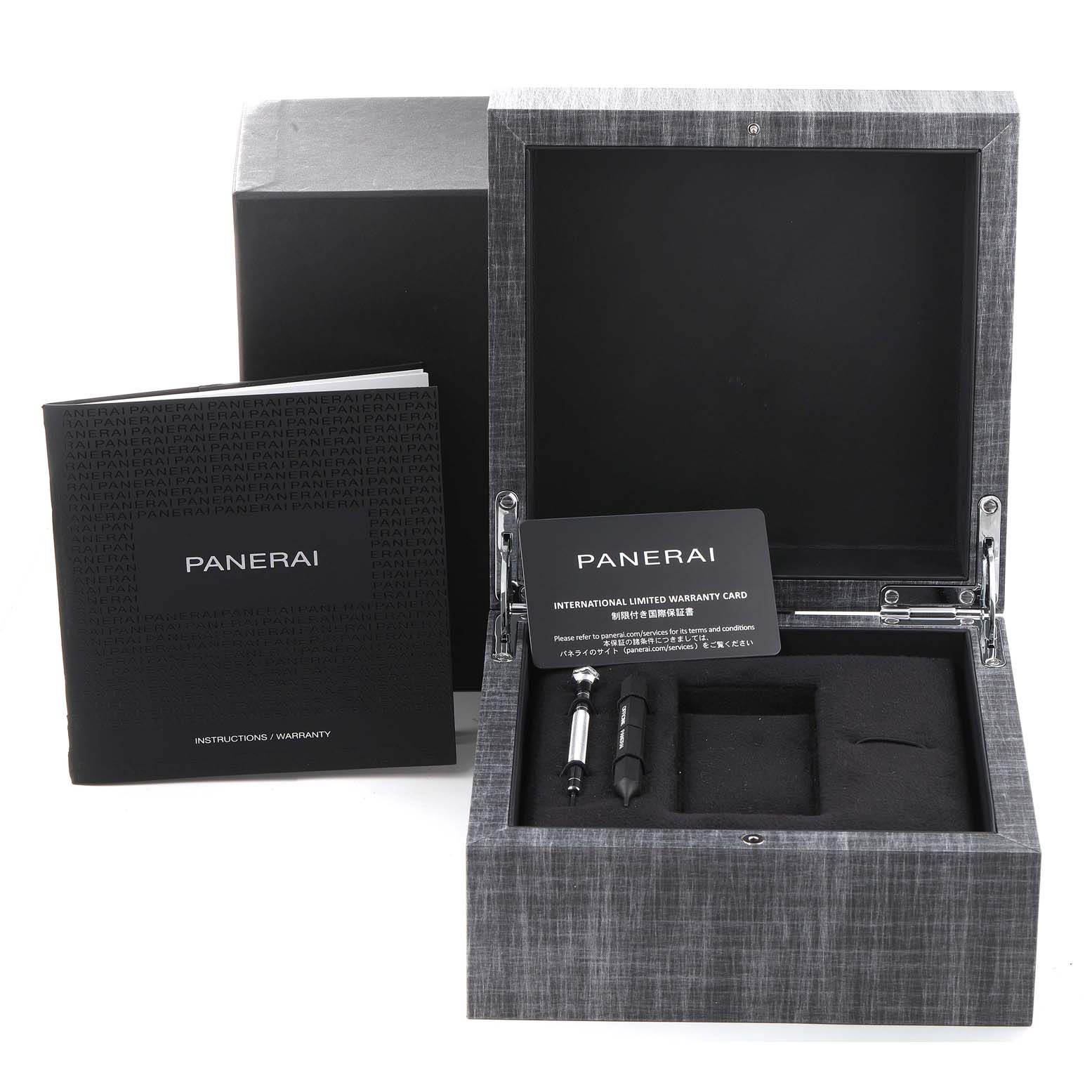 The image shows an open Panerai Luminor PAM01096 Men's Titanium Black Dial PAM01096 Men's Titanium Black Dial watch box with warranty card, tools, and an instruction booklet.