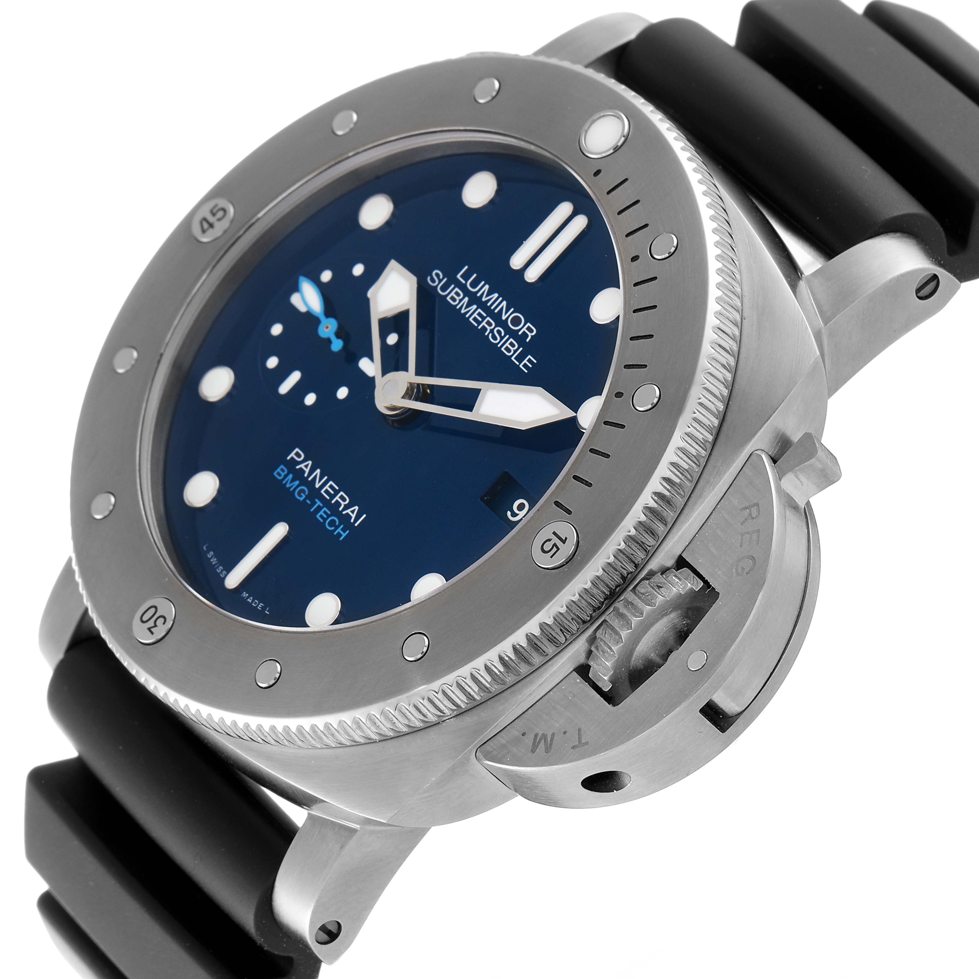 The image shows an angled close-up of a Panerai Luminor Submersible watch, highlighting the bezel, dial, and crown guard.