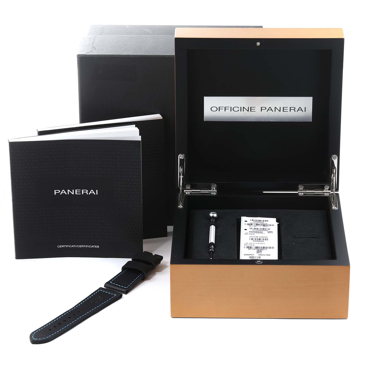 The image shows an open box, booklets, a strap, and a tool for the Panerai Submersible PAM00692 Men
s Stainless Steel Blue Dial PAM00692 Men
s Stainless Steel Blue Dial watch.