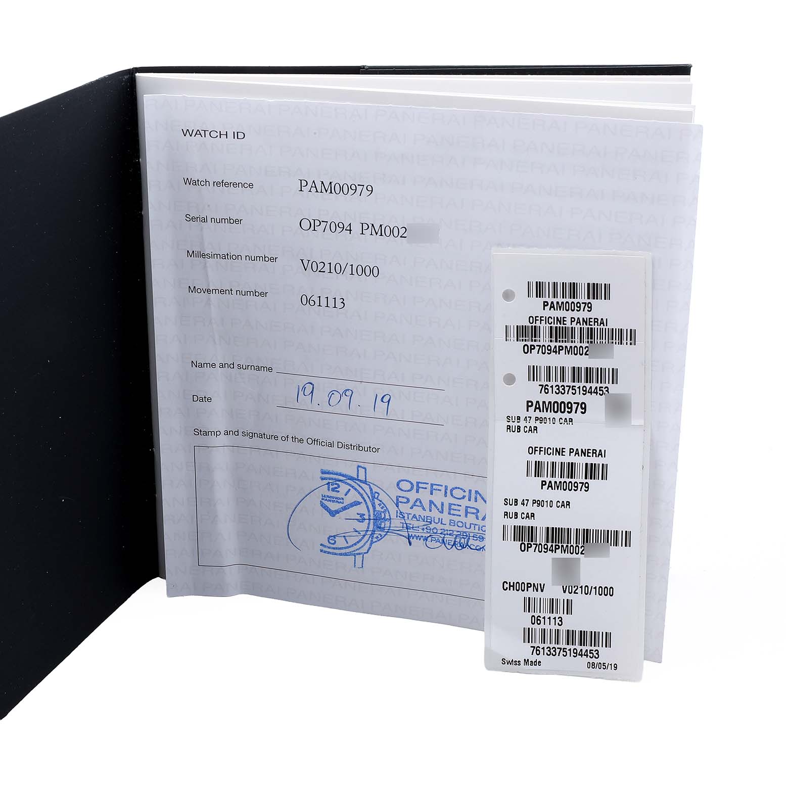 The image shows the documentation and tags for a Panerai Submersible PAM00979 Men's Titanium Grey Dial model, viewed open and facing forward.