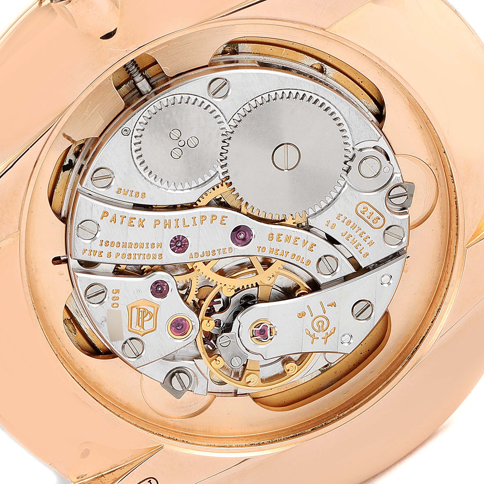 This image shows the intricate internal mechanical movement of a Patek Philippe Calatrava 5123R-001 Men's Rose Gold Silver Dial 5123R-001 Men's Rose Gold Silver Dial watch from a rear angle.