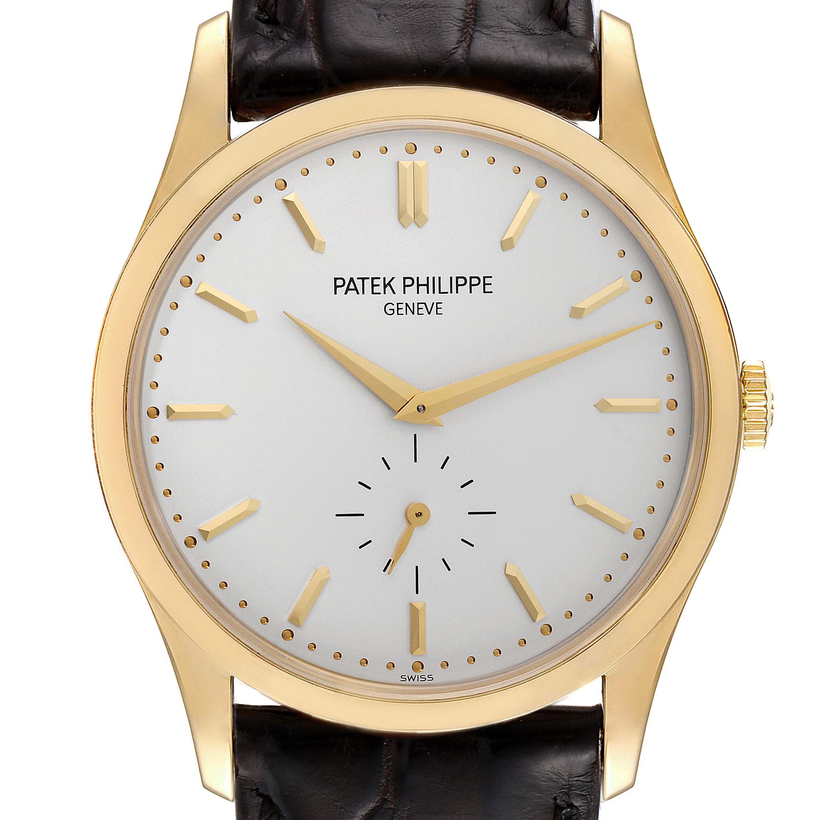 The image shows a front view of the Patek Philippe Calatrava 5196J Men's Yellow Gold Silver Dial 5196J Men's Yellow Gold Silver Dial watch, highlighting the face, hands, and strap.