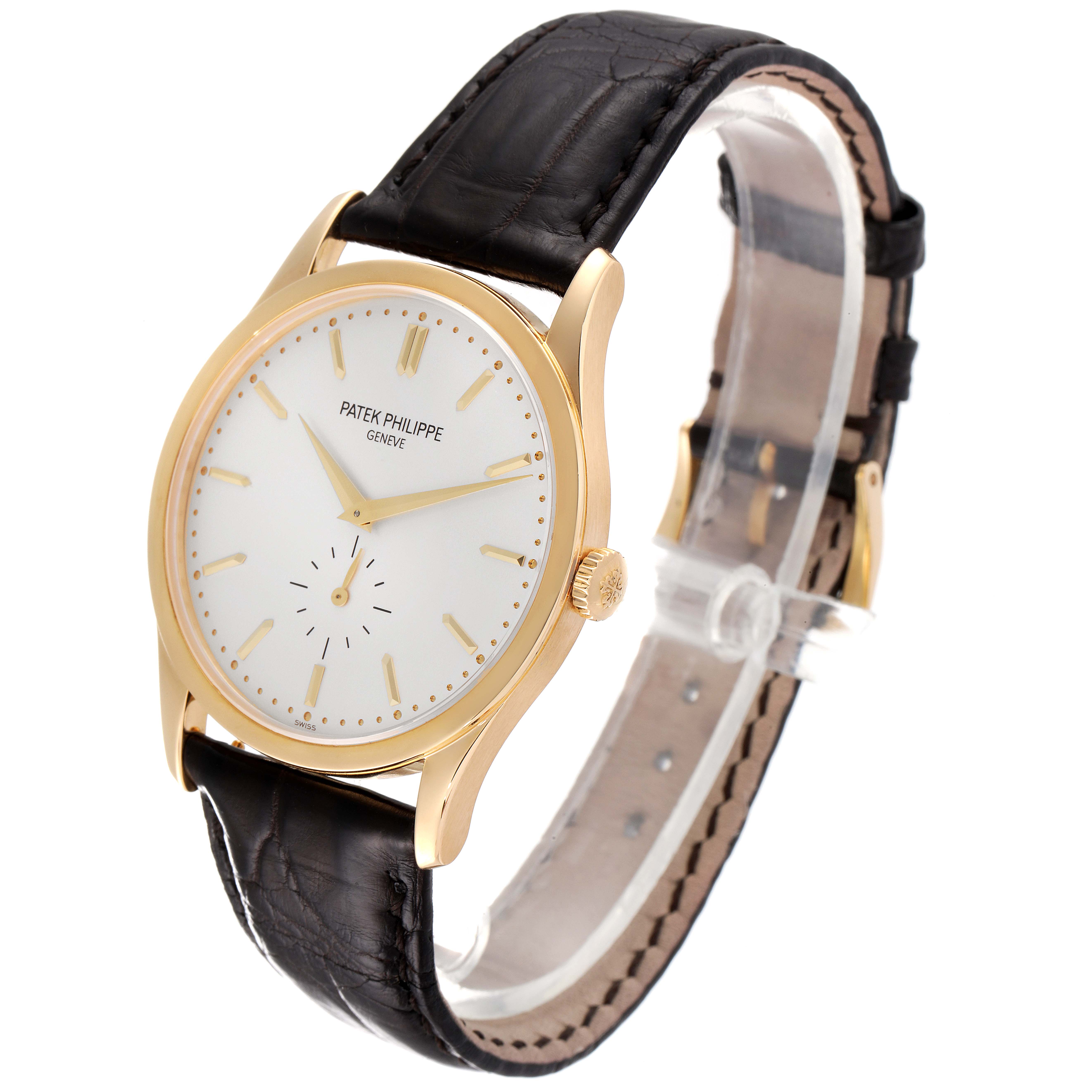 The image shows a front-angle view of a Patek Philippe Calatrava 5196J Men's Yellow Gold Silver Dial 5196J Men's Yellow Gold Silver Dial model watch, highlighting the dial, hands, and strap.