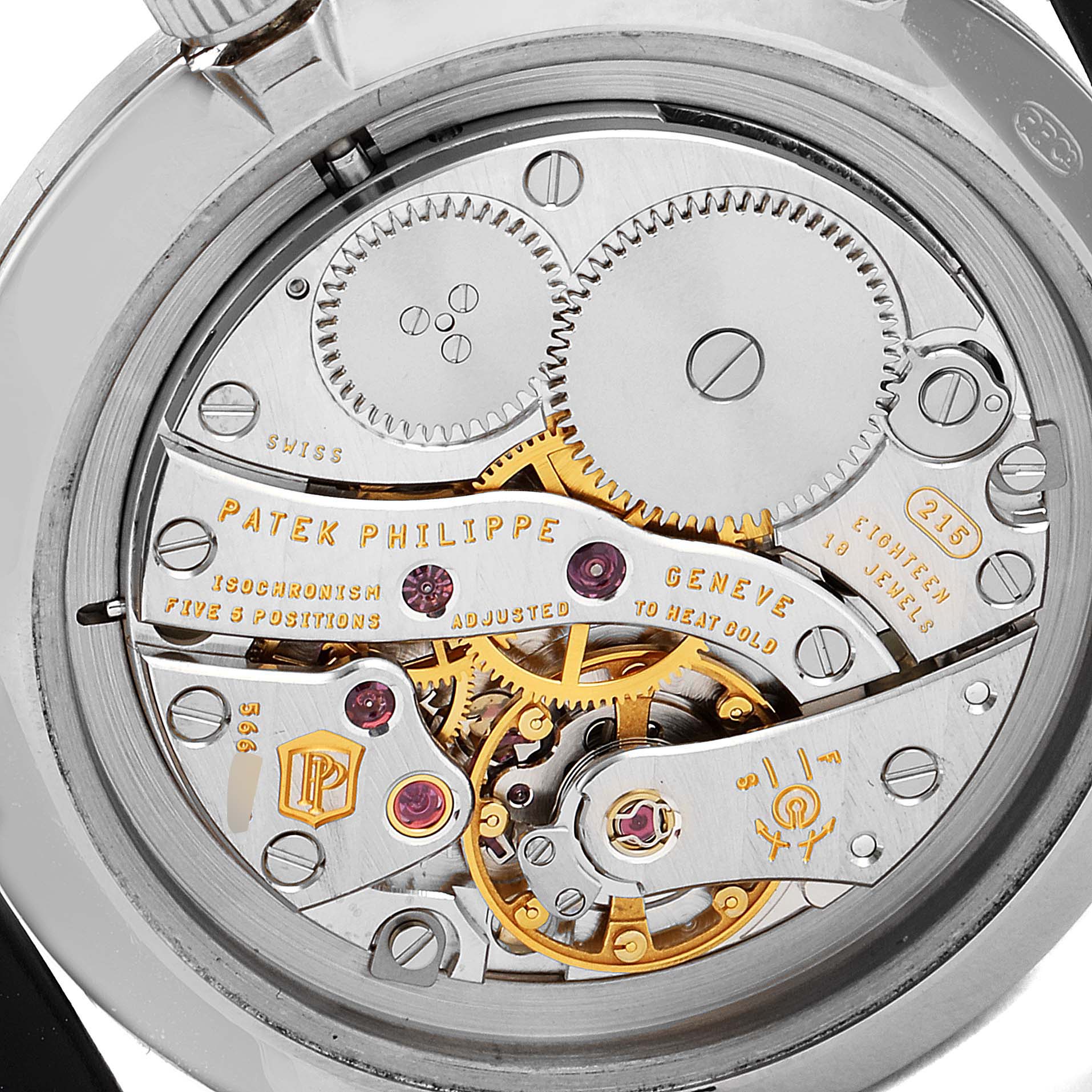 The image shows a close-up view of the movement of a Patek Philippe Calatrava 7119G Women's White Gold White Dial 7119G Women's White Gold White Dial watch, highlighting internal gears and components.