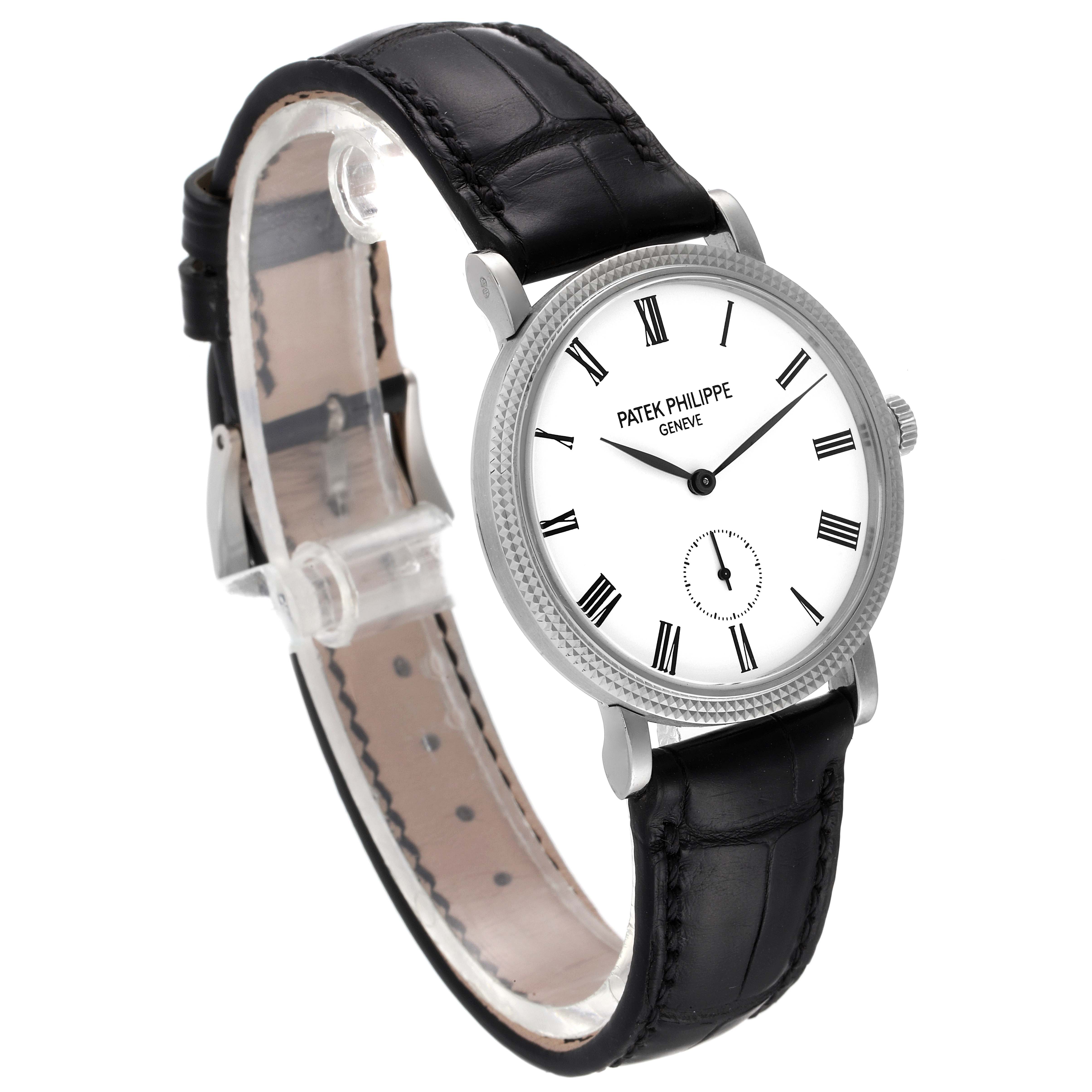 The image shows a side angle of the Patek Philippe Calatrava 7119G Women's White Gold White Dial 7119G Women's White Gold White Dial watch, highlighting the face, bezel, and leather strap.