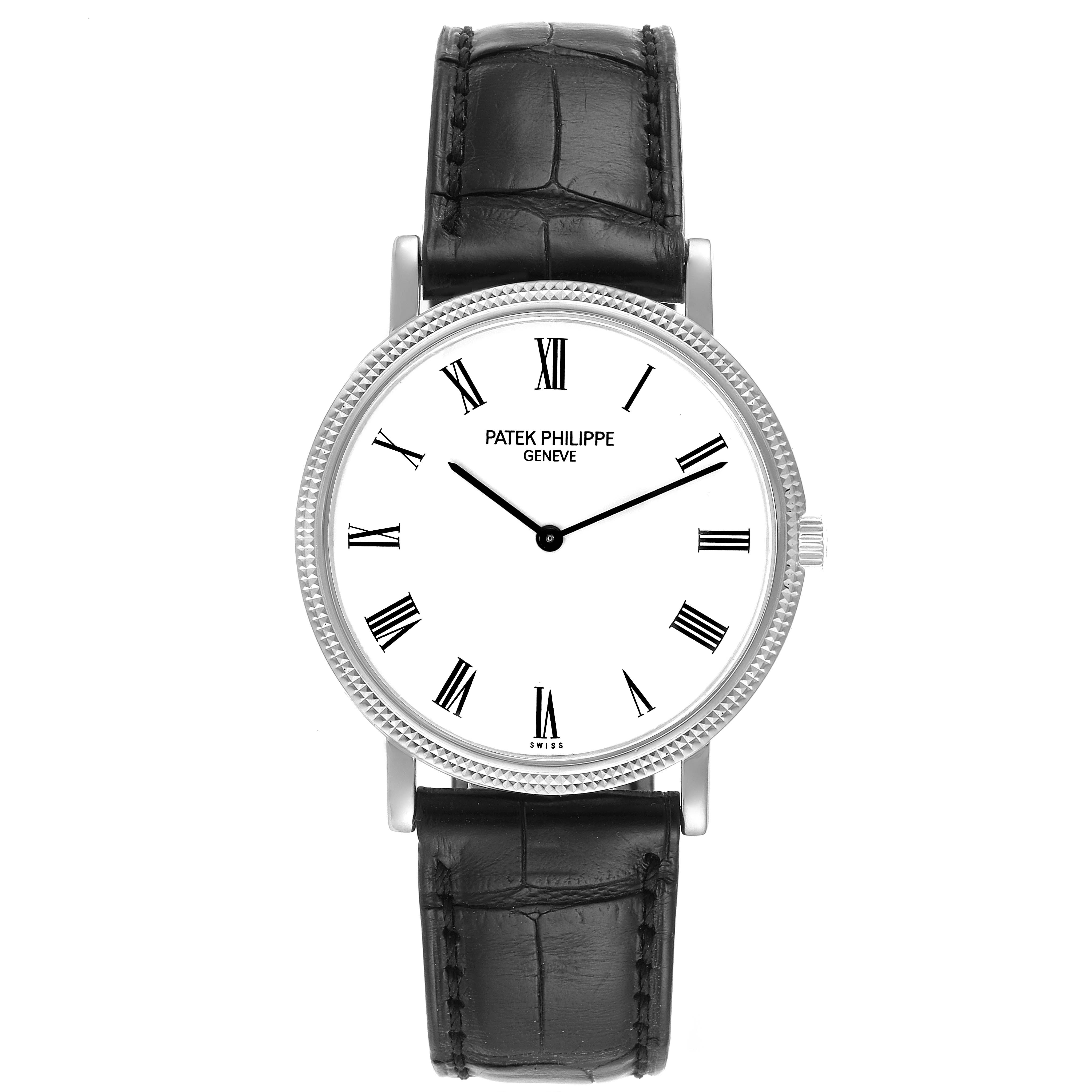The image shows a front view of a Patek Philippe Calatrava 5120G Men's White Gold White Dial 5120G Men's White Gold White Dial watch, displaying its Roman numerals, white dial, and black leather strap.