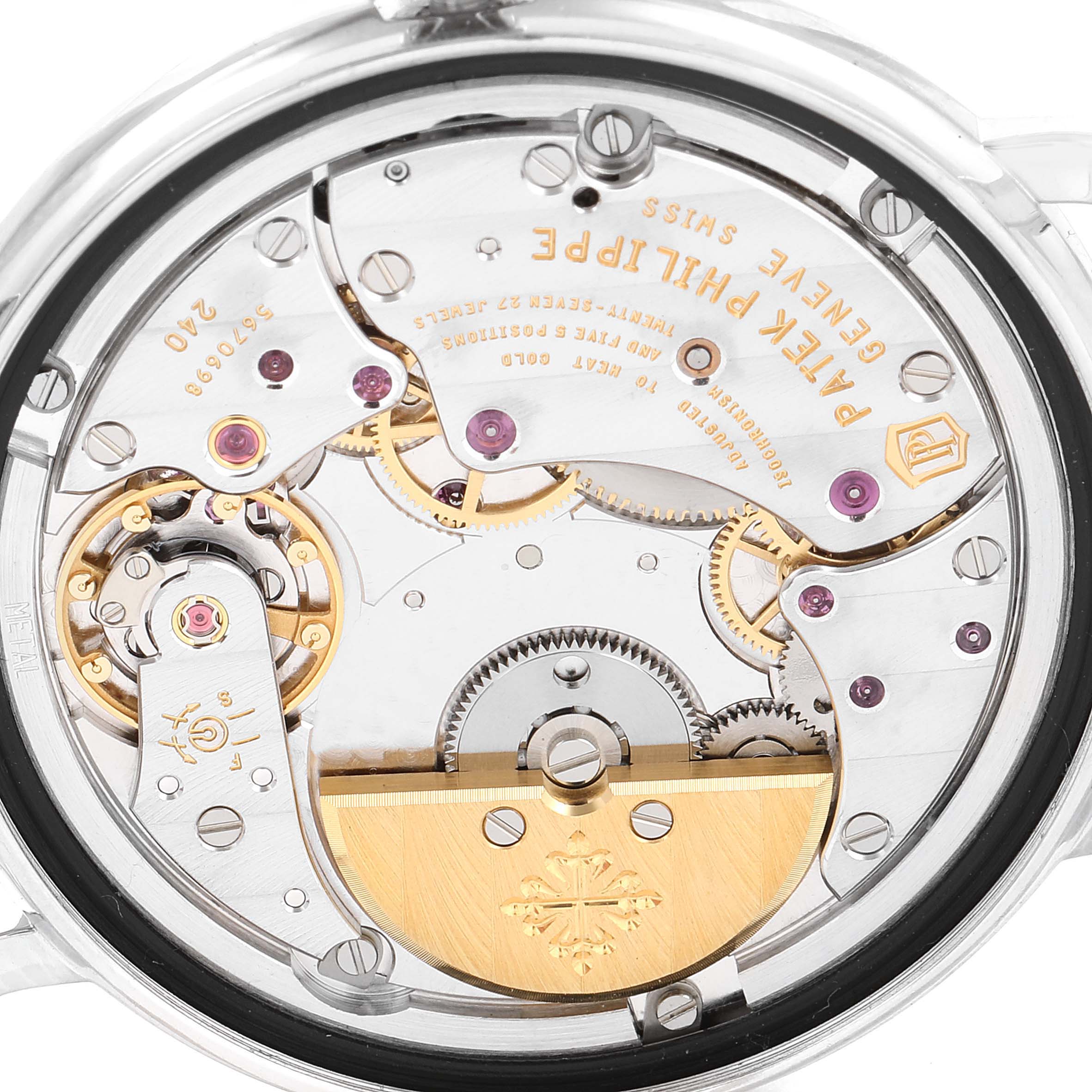 The image shows the back view of the Patek Philippe Calatrava 5120G Men's White Gold White Dial 5120G Men's White Gold White Dial watch, highlighting its intricate internal mechanics.