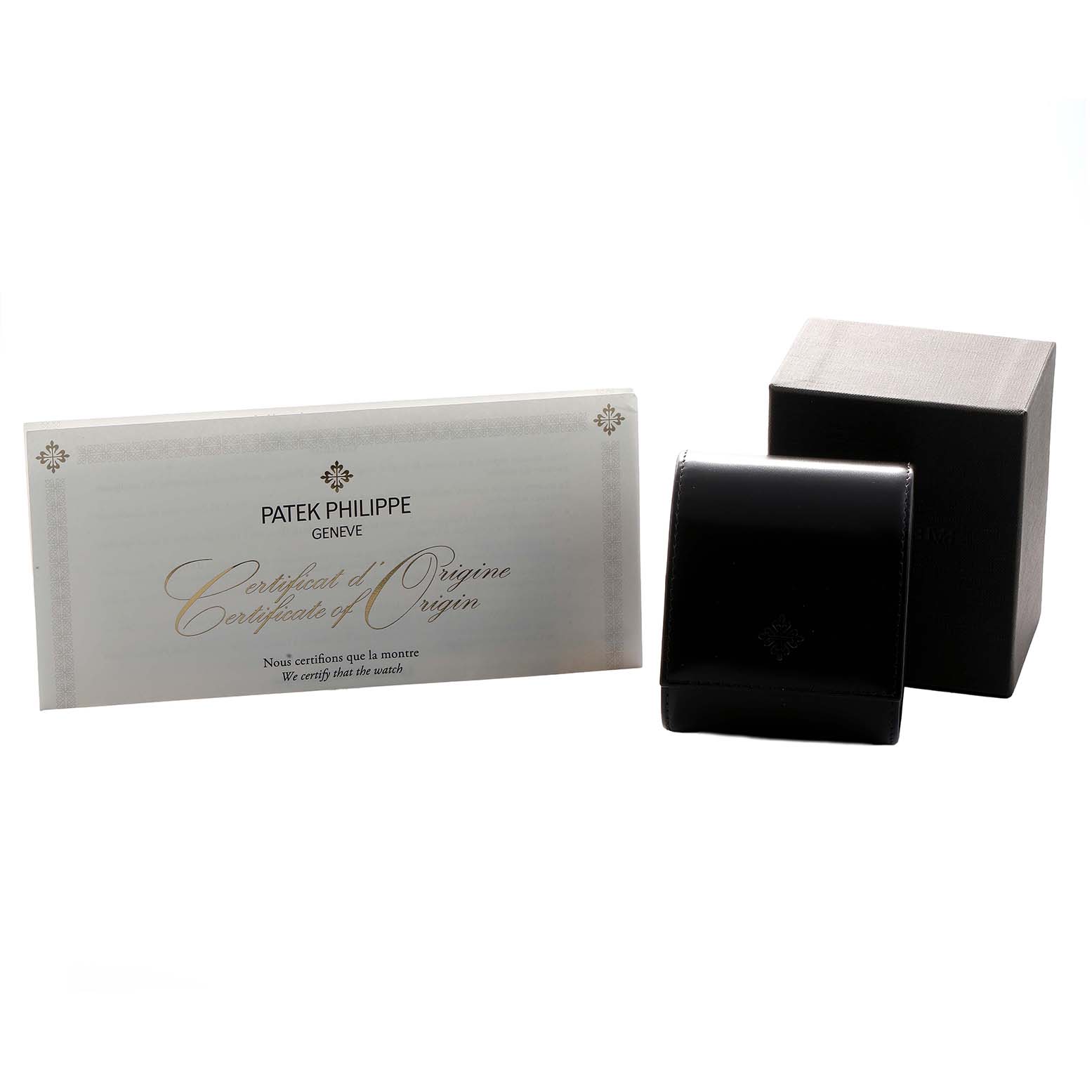 The image shows the Patek Philippe Calatrava 6119G-001 Men's White Gold Grey Dial watch box and a Certificate of Origin from a frontal angle.