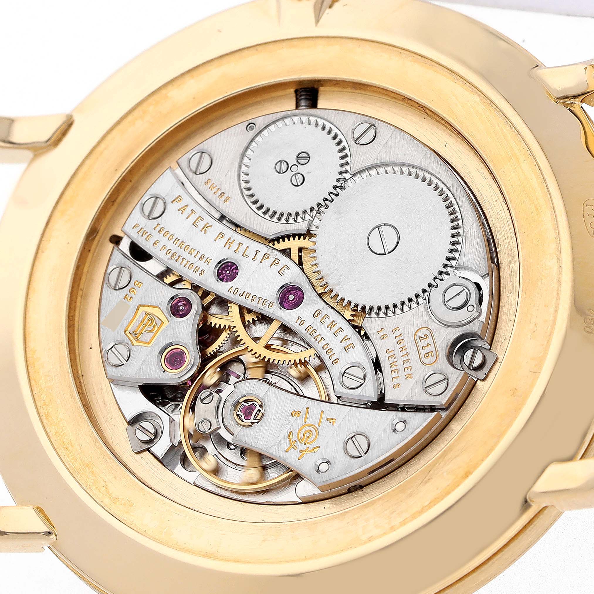 The image shows the back view of a Patek Philippe Calatrava 5119J-001 Men's Yellow Gold White Dial, highlighting its intricate mechanical movement.