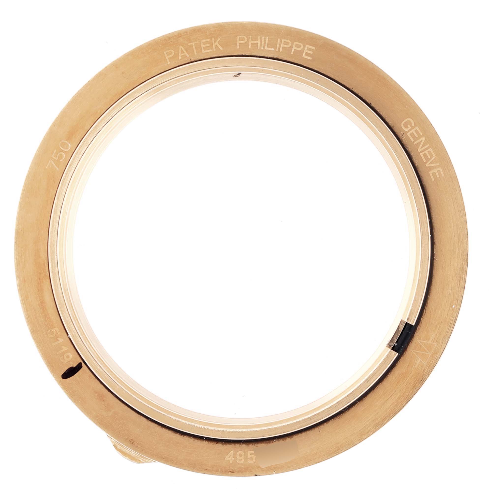 The image shows an overhead view of the bezel for a Patek Philippe Calatrava 5119J-001 Men's Yellow Gold White Dial watch.