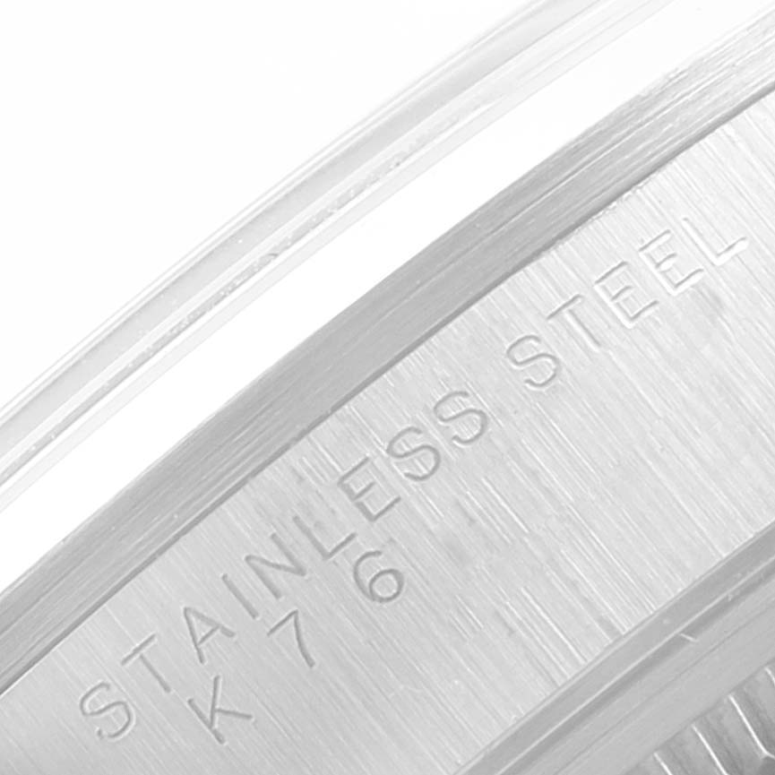 This image shows a close-up of the case back edge of a Rolex Air-King 14000 Men's Stainless Steel Blue Dial 14000 Men's Stainless Steel Blue Dial watch, showcasing the "STAINLESS STEEL" engraving.