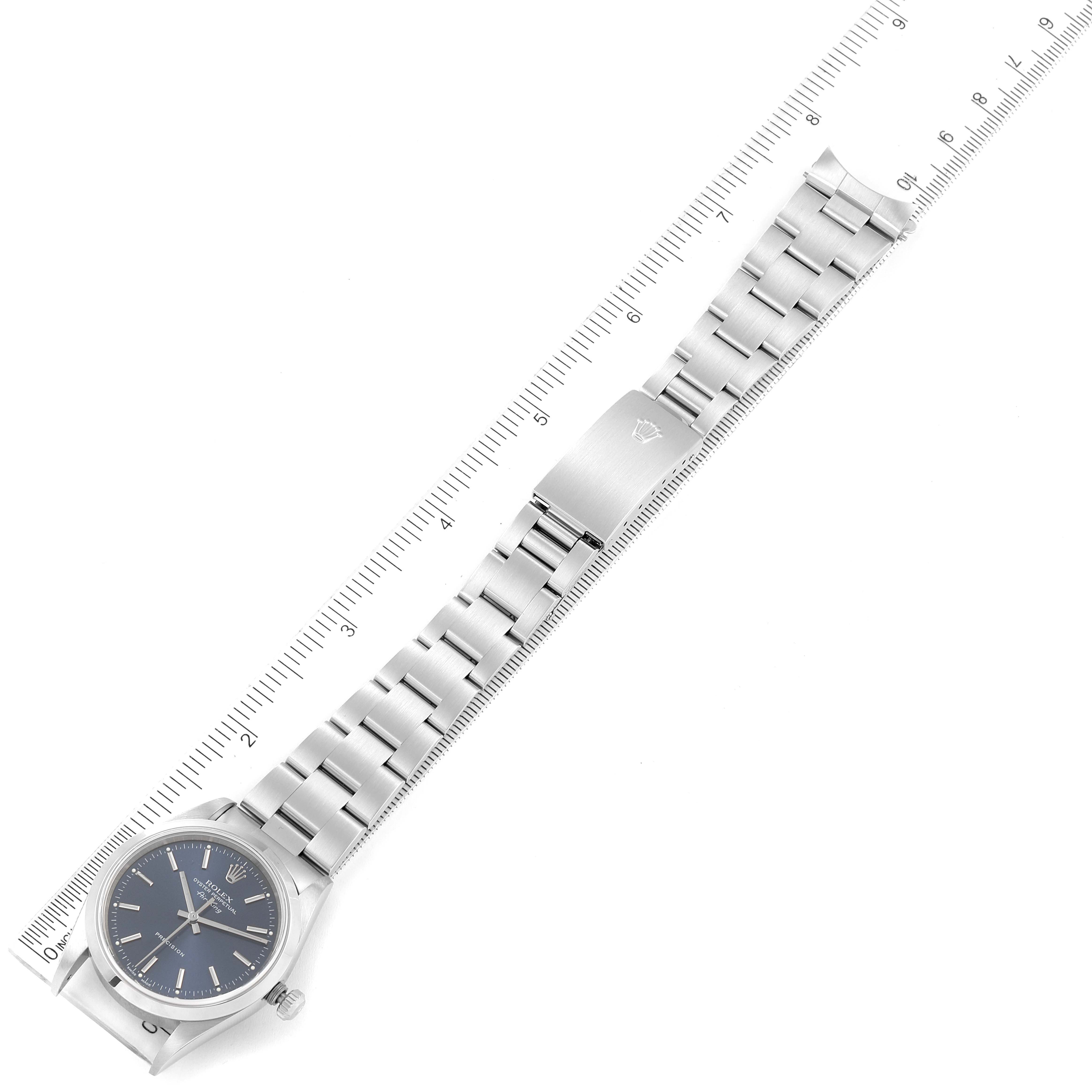 The image shows a Rolex Air-King 14000 Men's Stainless Steel Blue Dial 14000 Men's Stainless Steel Blue Dial watch laid flat next to a ruler, displaying the dial, bracelet, and clasp.
