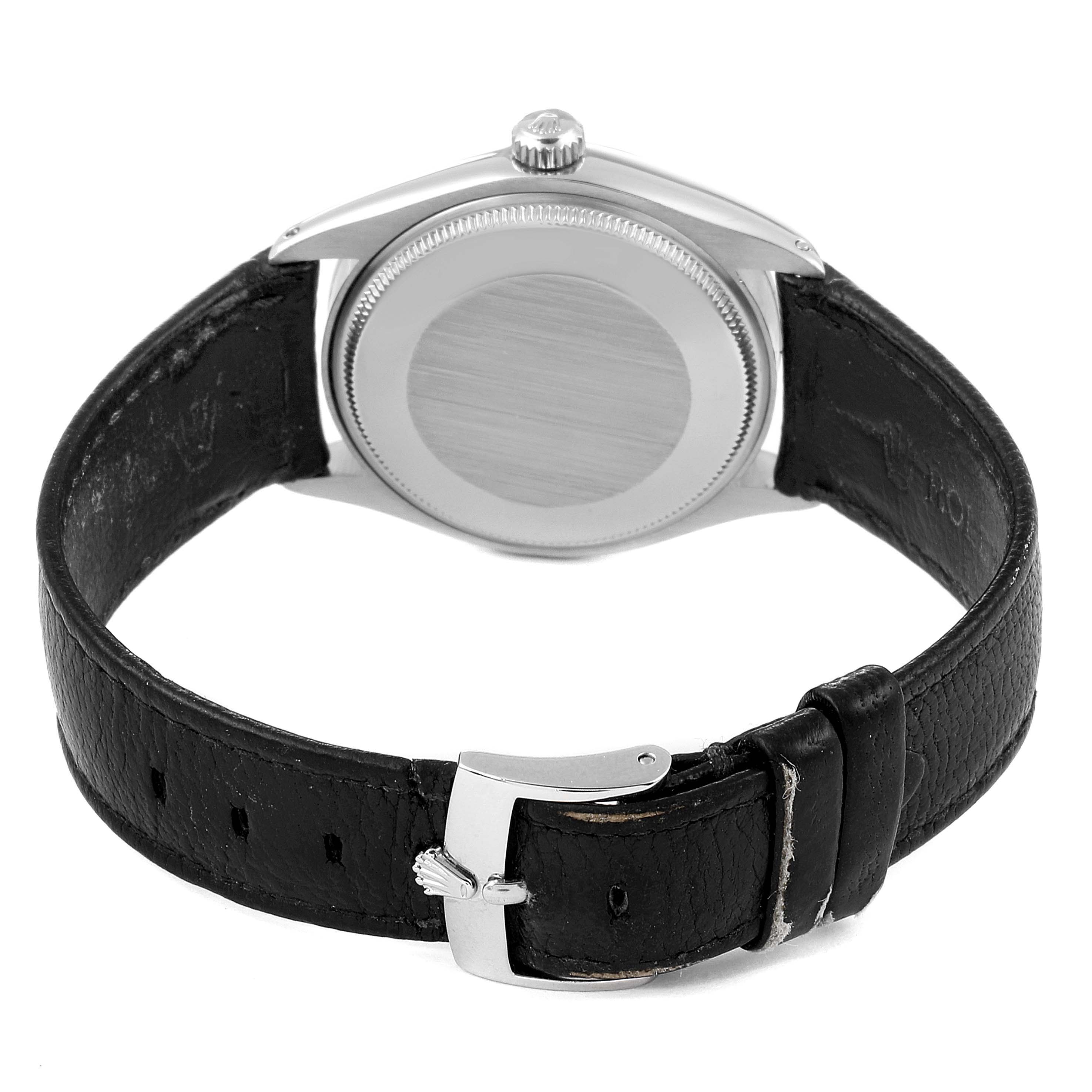 This image shows the back view of a Rolex Vintage Collection 5500 Men's Stainless Steel Silver Dial 5500 Men's Stainless Steel Silver Dial watch, highlighting its case, crown, and leather strap with a clasp.