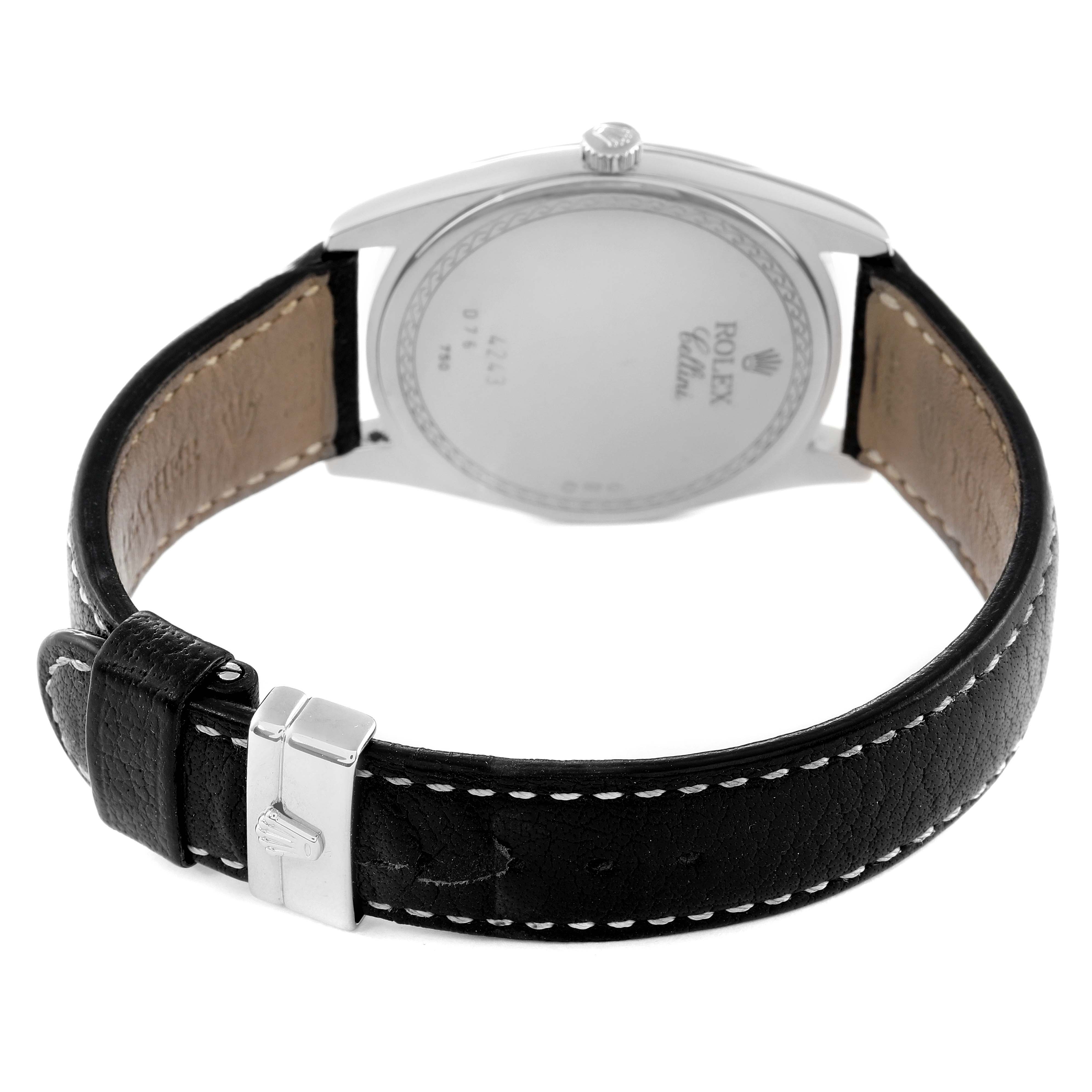 The image shows the back view of a Rolex Cellini 4243 Men
s Stainless Steel Silver Dial 4243 Men
s Stainless Steel Silver Dial model watch, highlighting the case back and leather strap with a buckle.