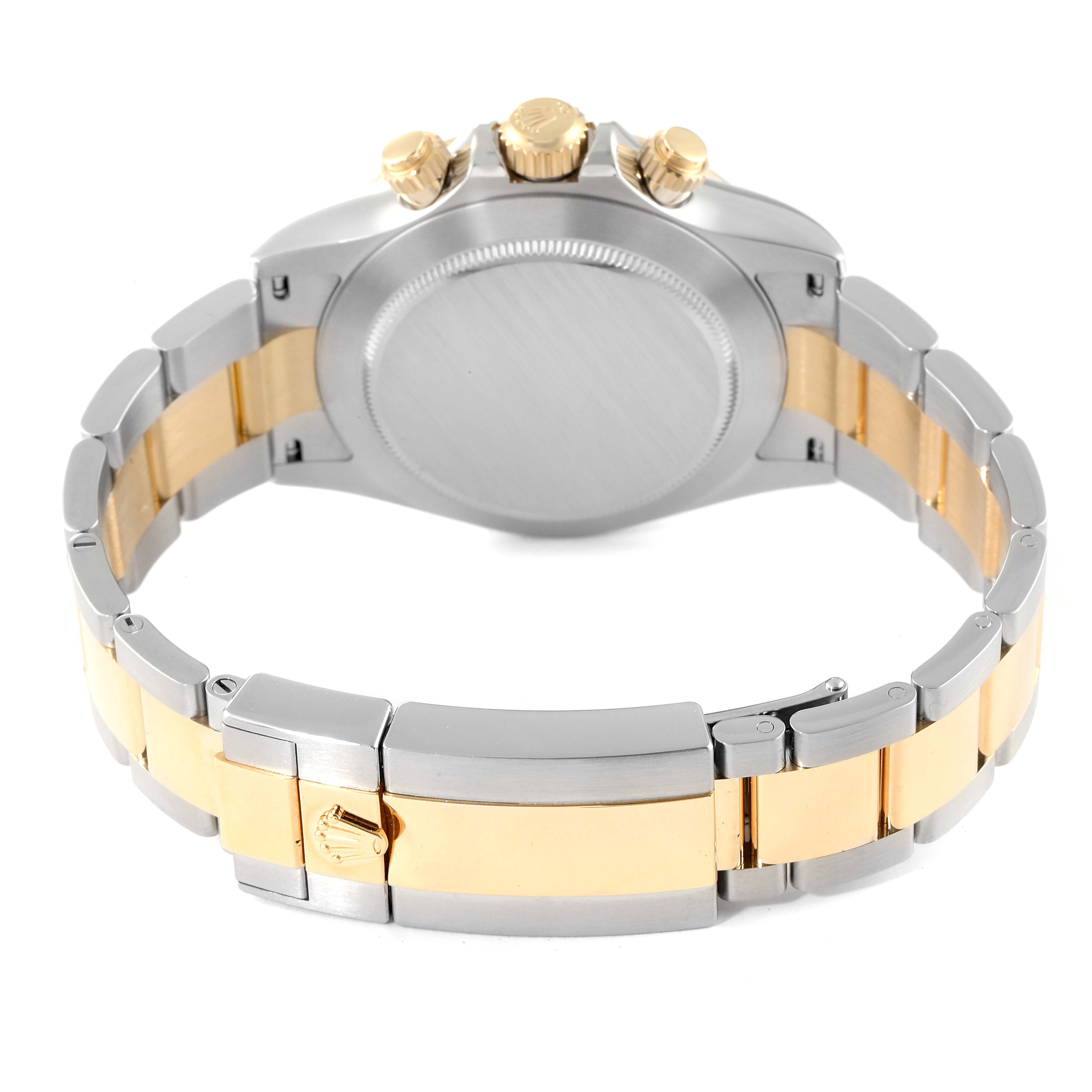 The image shows the back, bracelet, and clasp of the Rolex Daytona 116503 Men
s Steel and Gold (two tone) Champagne Dial 116503 Men
s Steel and Gold (two tone) Champagne Dial watch, featuring a two-tone gold and silver design.