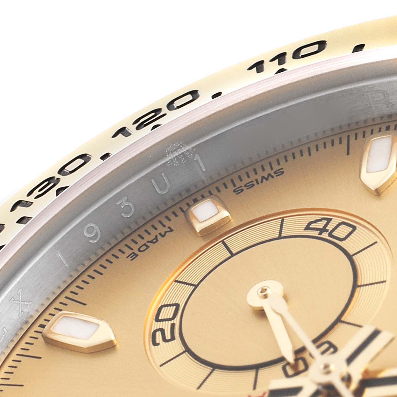 A close-up of the Rolex Daytona 116503 Men
s Steel and Gold (two tone) Champagne Dial 116503 Men
s Steel and Gold (two tone) Champagne Dial watch showing part of the bezel, dial, and subdial.