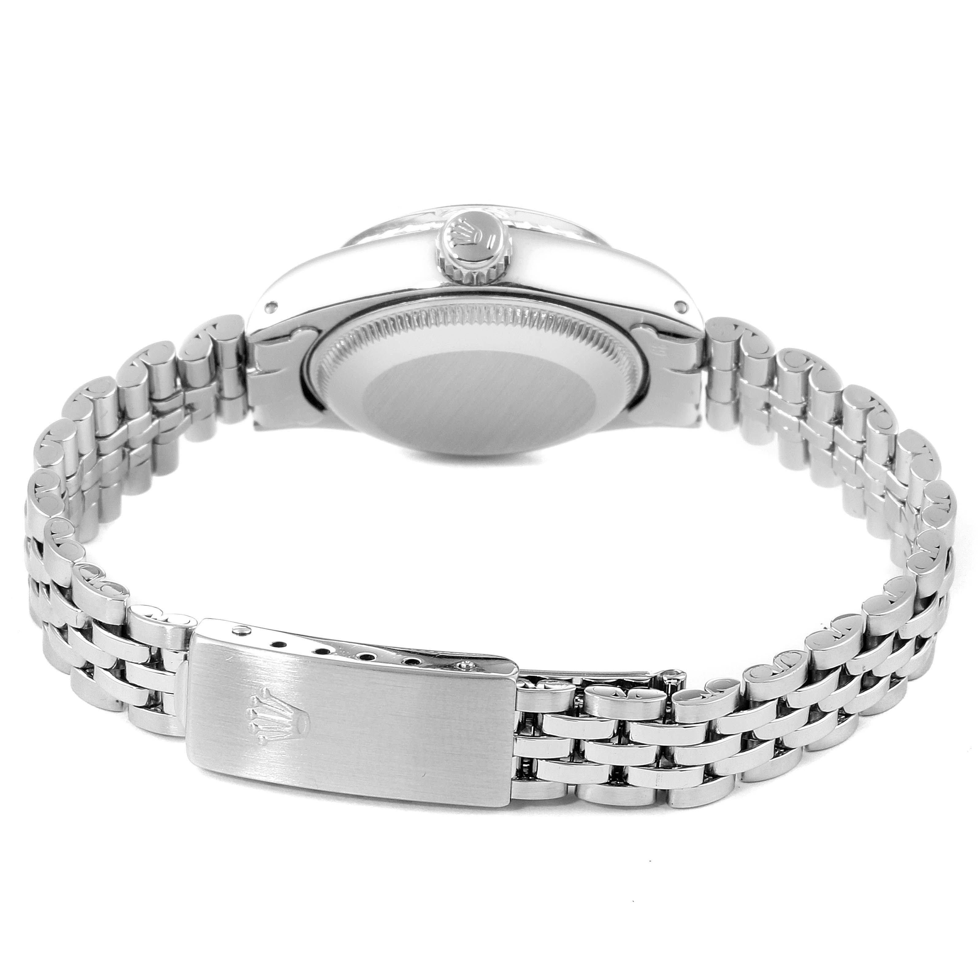 The image shows the back view of a Rolex Date 6924 Women
s Stainless Steel Silver Dial 6924 Women
s Stainless Steel Silver Dial model watch, highlighting its clasp, crown, and bracelet.