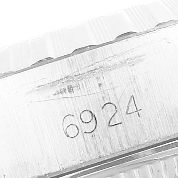 This image shows the engraved caseback and side view of the Rolex Date 6924 Women
s Stainless Steel Silver Dial 6924 Women
s Stainless Steel Silver Dial model watch, specifically the model number 6924.
