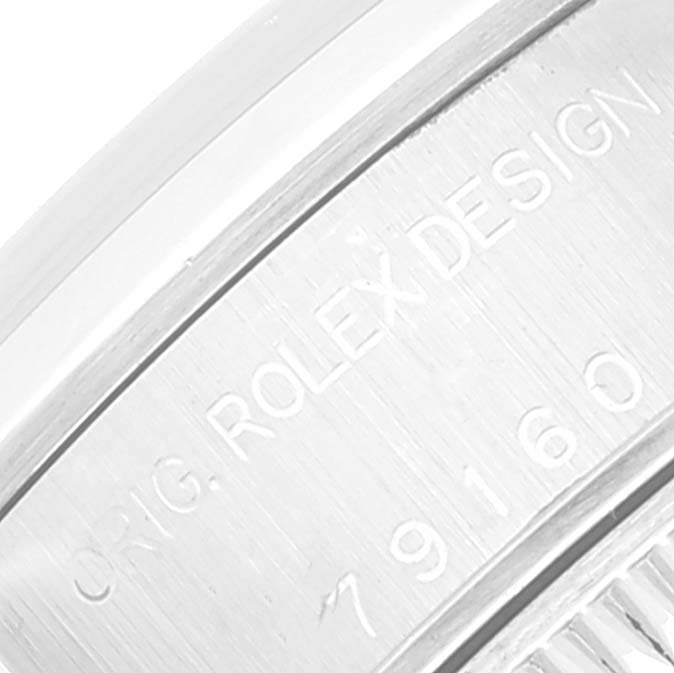 The image shows a close-up of the case with engraved details of a Rolex Date 79160 Women's Stainless Steel White Dial 79160 Women's Stainless Steel White Dial model watch.