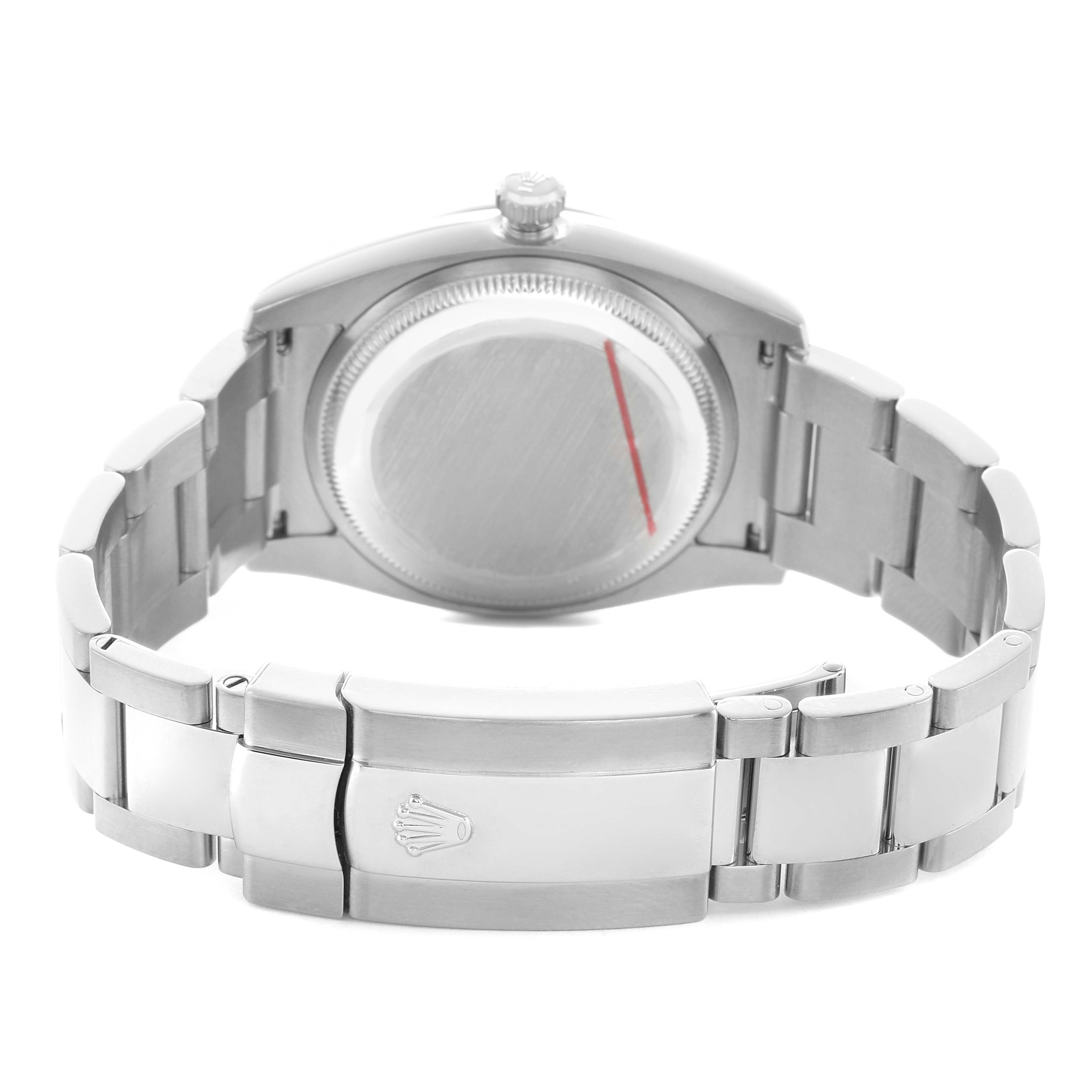 The Rolex Date 115200 Men's Stainless Steel White Dial model is shown from the back, displaying the case back, crown, and bracelet with the clasp.