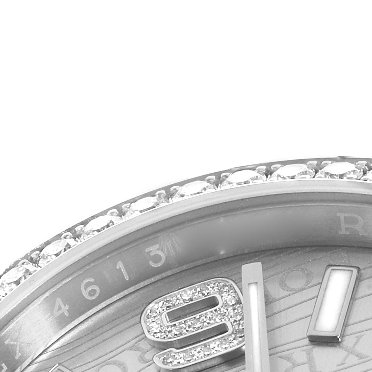 The image shows a close-up of the bezel and part of the dial of a Rolex Datejust 116244 Men's Stainless Steel Silver Dial, featuring diamond accents and numerals.