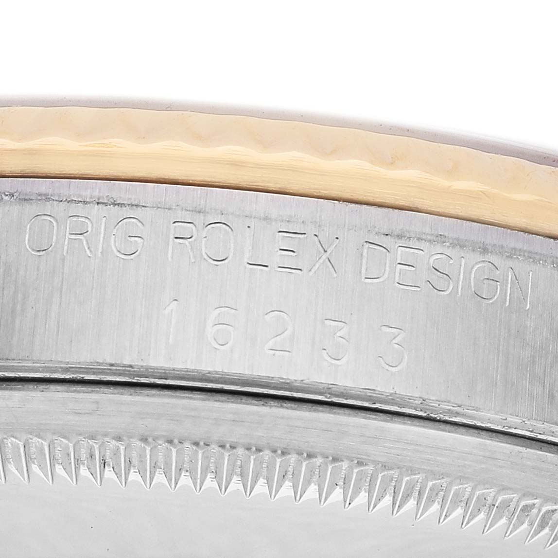 The image shows a close-up of the Rolex Datejust 16233 Men's Steel and Gold (two tone) Silver Dial's side, displaying the bezel edge and engraved model number.