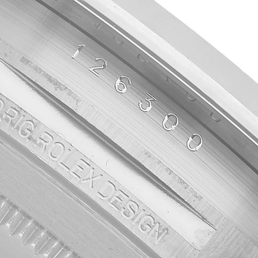 The image shows the engraving on the inner bezel of the Rolex Datejust 41 126300 Men's Stainless Steel Grey Dial, highlighting its model number and "ORIG ROLEX DESIGN."