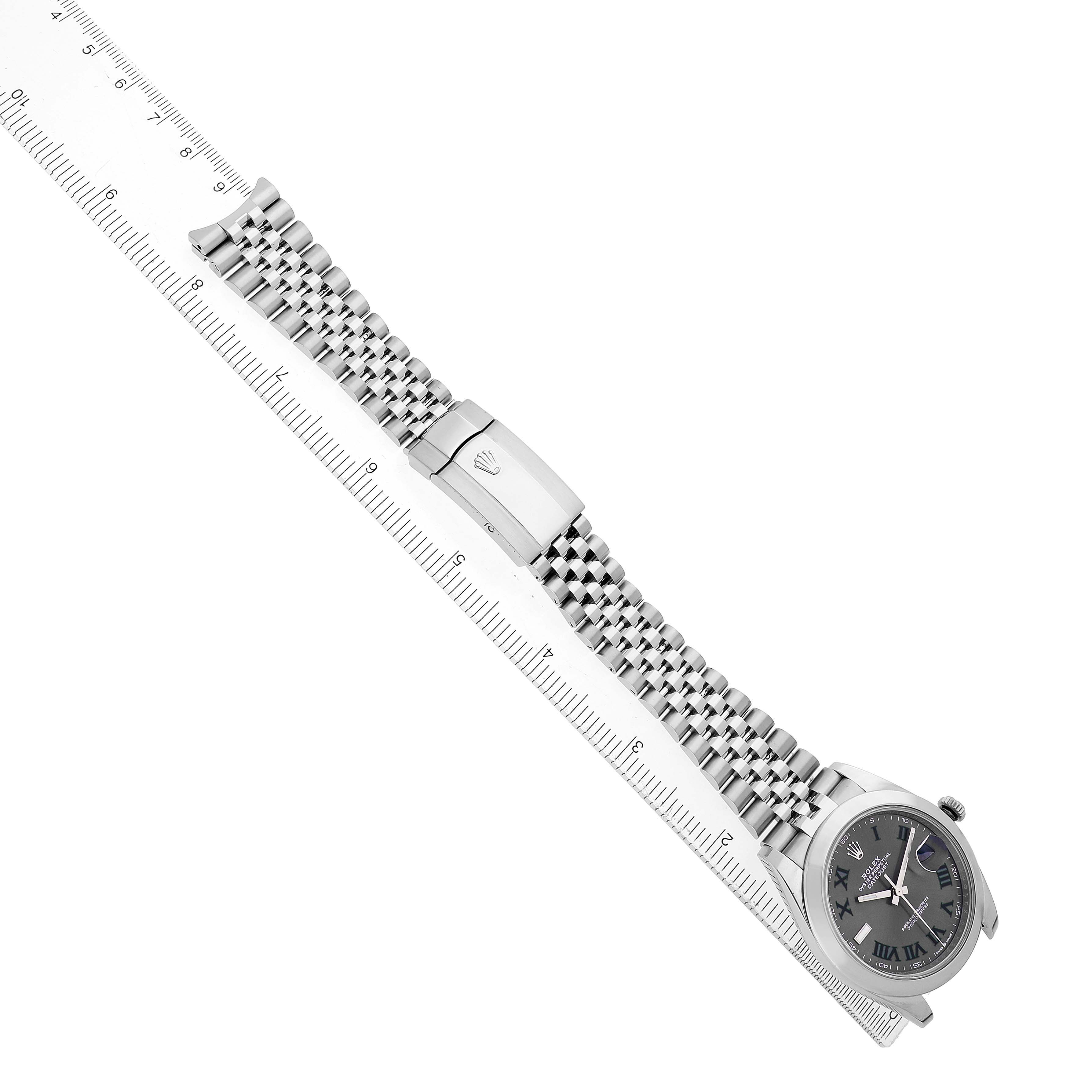 The Rolex Datejust 41 126300 Men's Stainless Steel Grey Dial is shown diagonally, displaying the face, bracelet, and clasp alongside a ruler for scale.