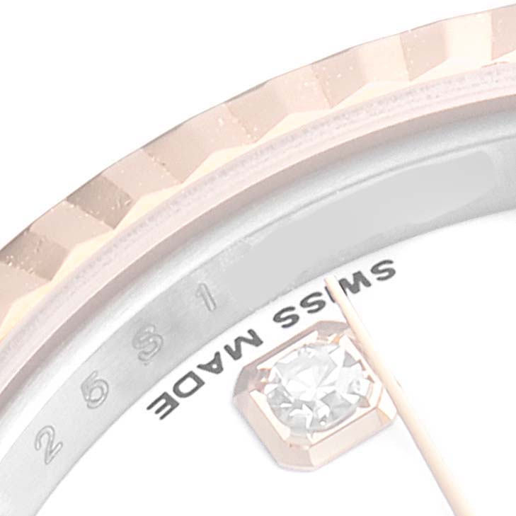 This close-up image of a Rolex Datejust 179171 Women's Steel and Gold (two tone) White Dial 179171 Women's Steel and Gold (two tone) White Dial watch shows the bezel, diamond hour marker, and partial text reading "SWISS MADE."