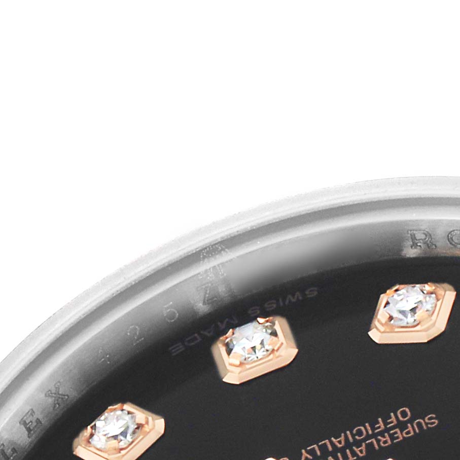 The image shows a close-up of a Rolex Datejust 179171 Women's Steel and Gold (two tone) Blue Dial watch's dial with diamond hour markers and part of the bezel.