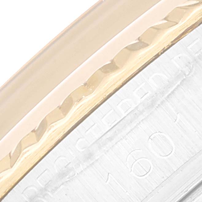 This close-up image shows the side engraving and partial bezel of a Rolex Datejust 1601 Men's Steel and Gold (two tone) Champagne Dial 1601 Men's Steel and Gold (two tone) Champagne Dial watch.