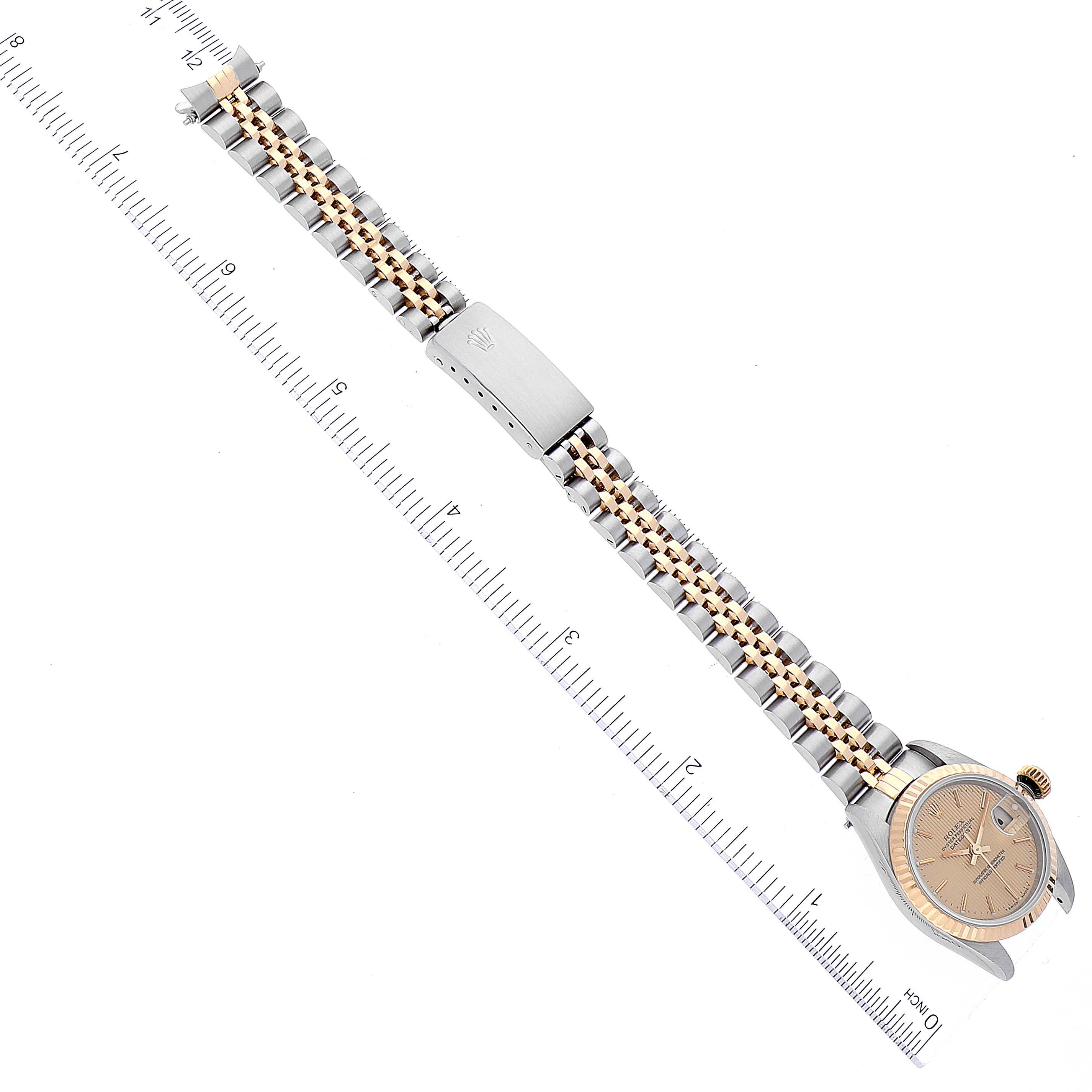 This image shows a Rolex Datejust 69173 Women's Steel and Gold (two tone) Champagne Dial 69173 Women's Steel and Gold (two tone) Champagne Dial watch laid flat, displaying the face, bracelet, and clasp with a labeled ruler for scale.