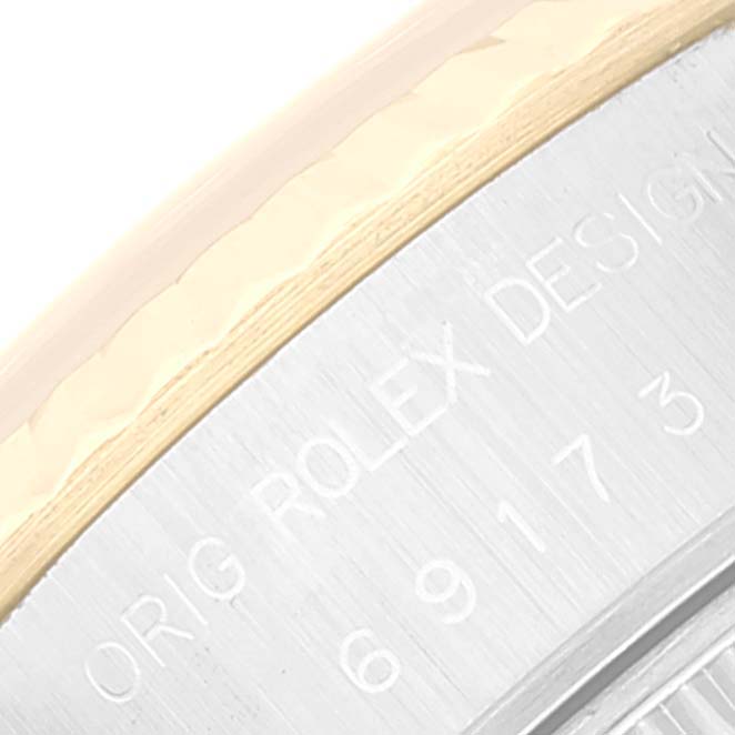 The image shows a close-up of the engraved text on the case back edge of a Rolex Datejust 69173 Women's Steel and Gold (two tone) Champagne Dial 69173 Women's Steel and Gold (two tone) Champagne Dial watch.