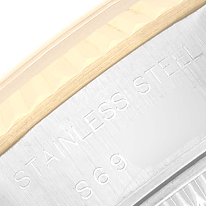 This close-up image shows part of the case and bezel of a Rolex Datejust 69173 Women's Steel and Gold (two tone) Champagne Dial 69173 Women's Steel and Gold (two tone) Champagne Dial watch, highlighting its stainless steel construction.