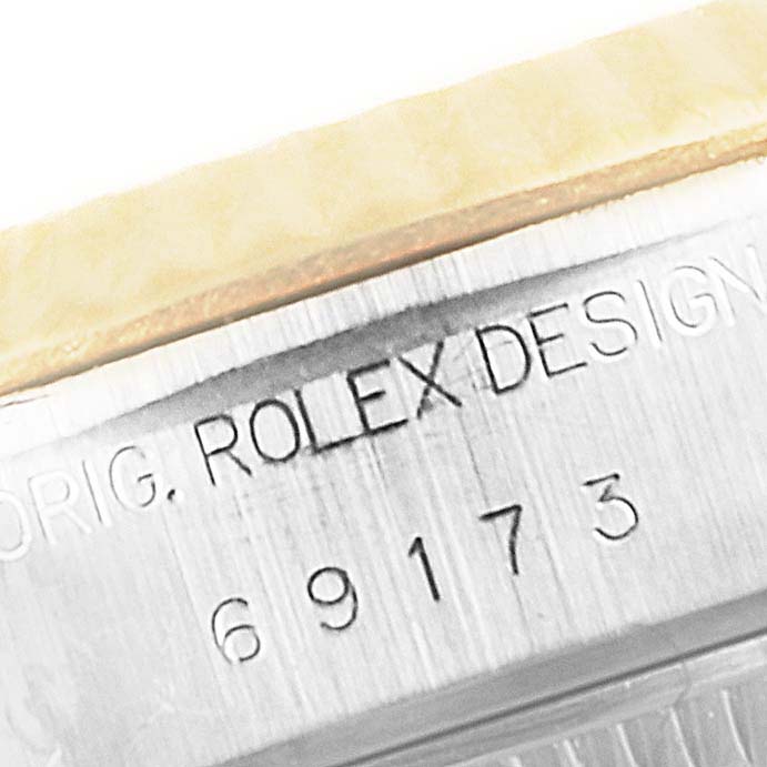 This image shows a close-up of the case side inscription and model number on a Rolex Datejust 69173 Women's Steel and Gold (two tone) Beige Dial 69173 Women's Steel and Gold (two tone) Beige Dial watch.