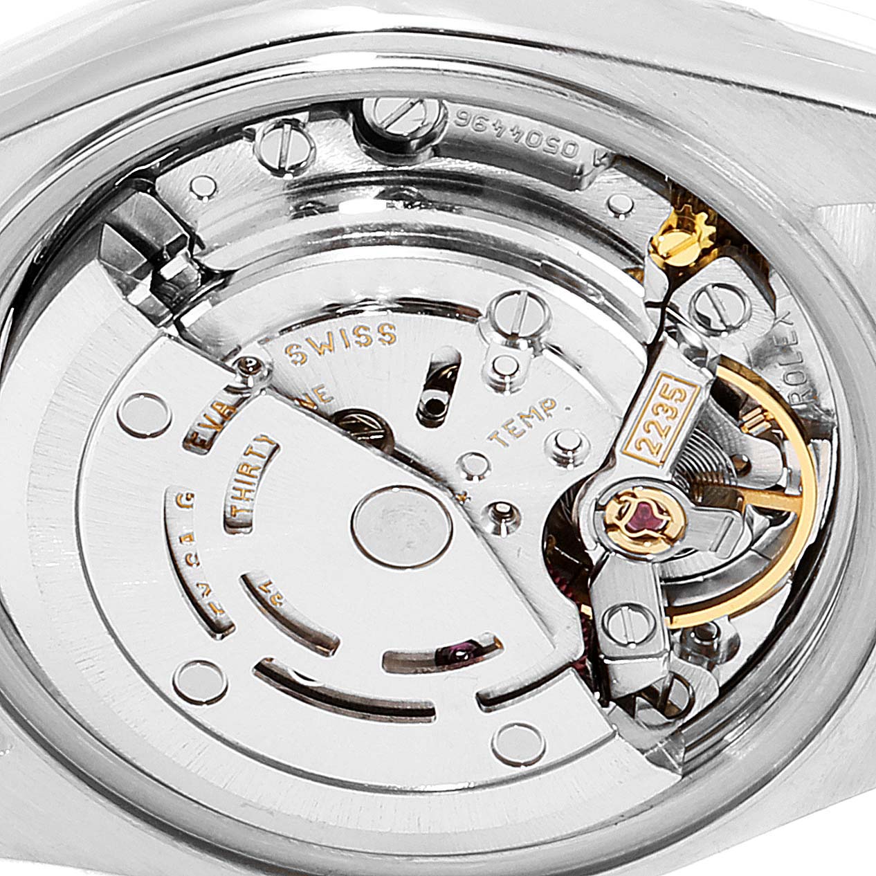 This image shows a close-up of the movement mechanics inside a Rolex Datejust 79163 Women's Steel and Gold (two tone) White Dial 79163 Women's Steel and Gold (two tone) White Dial watch.