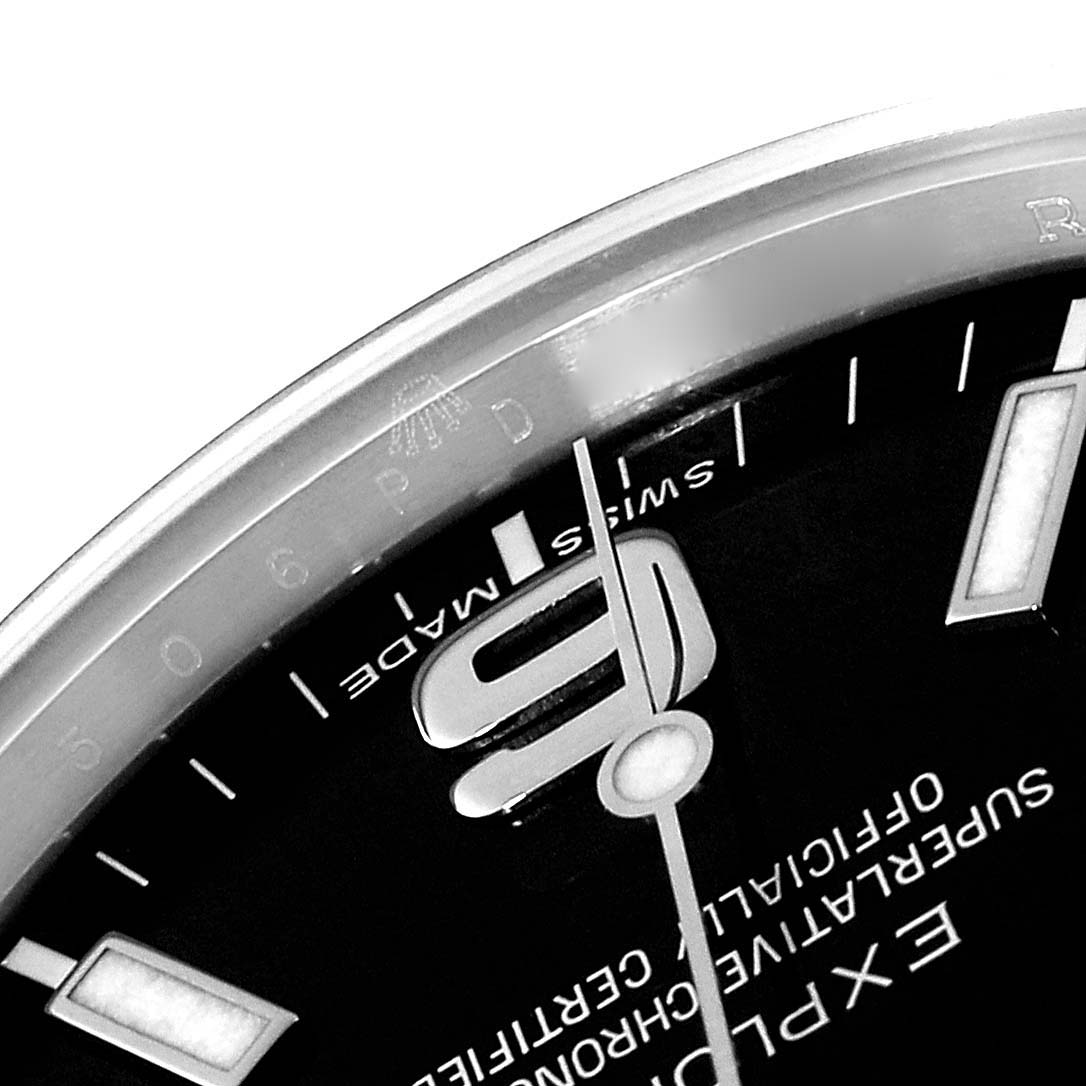 Close-up of the Rolex Explorer 214270 Men's Stainless Steel Black Dial 214270 Men's Stainless Steel Black Dial watch, showing the dial, hands, and part of the bezel at a slight angle.