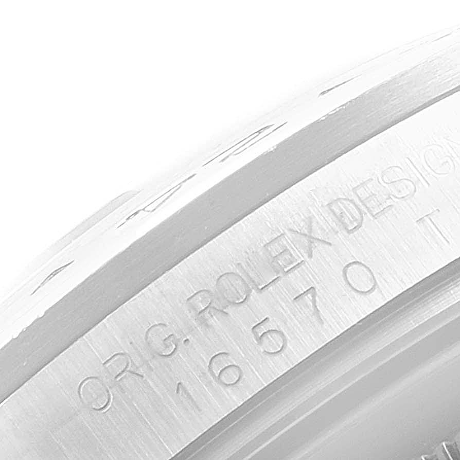 The image shows a close-up of the side engravings on a Rolex Explorer 16570 Men
s Stainless Steel White Dial 16570 Men
s Stainless Steel White Dial watch model 16570.