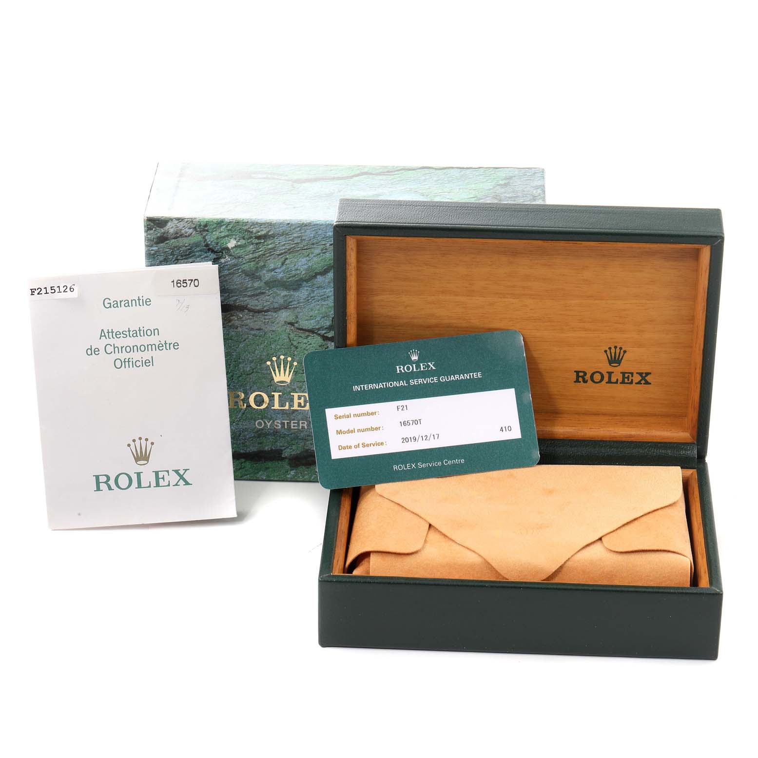 The image shows the packaging, warranty card, and service guarantee for a Rolex Explorer 16570 Men
s Stainless Steel White Dial 16570 Men
s Stainless Steel White Dial model.