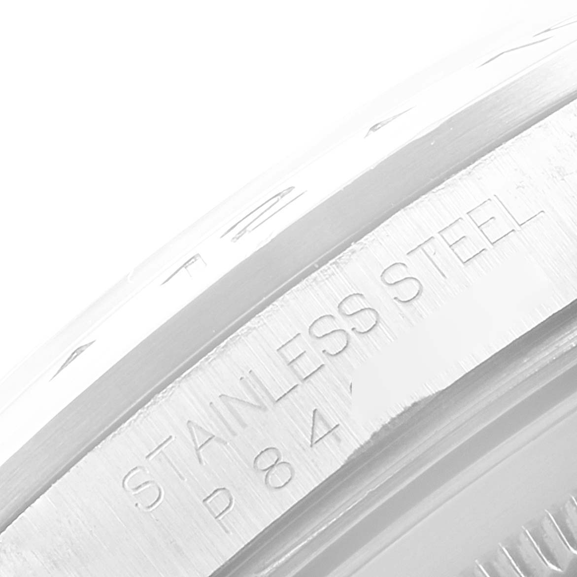 This close-up image shows the stainless steel part of the bezel and case back of a Rolex Explorer 16570 Men
s Stainless Steel White Dial 16570 Men
s Stainless Steel White Dial watch.
