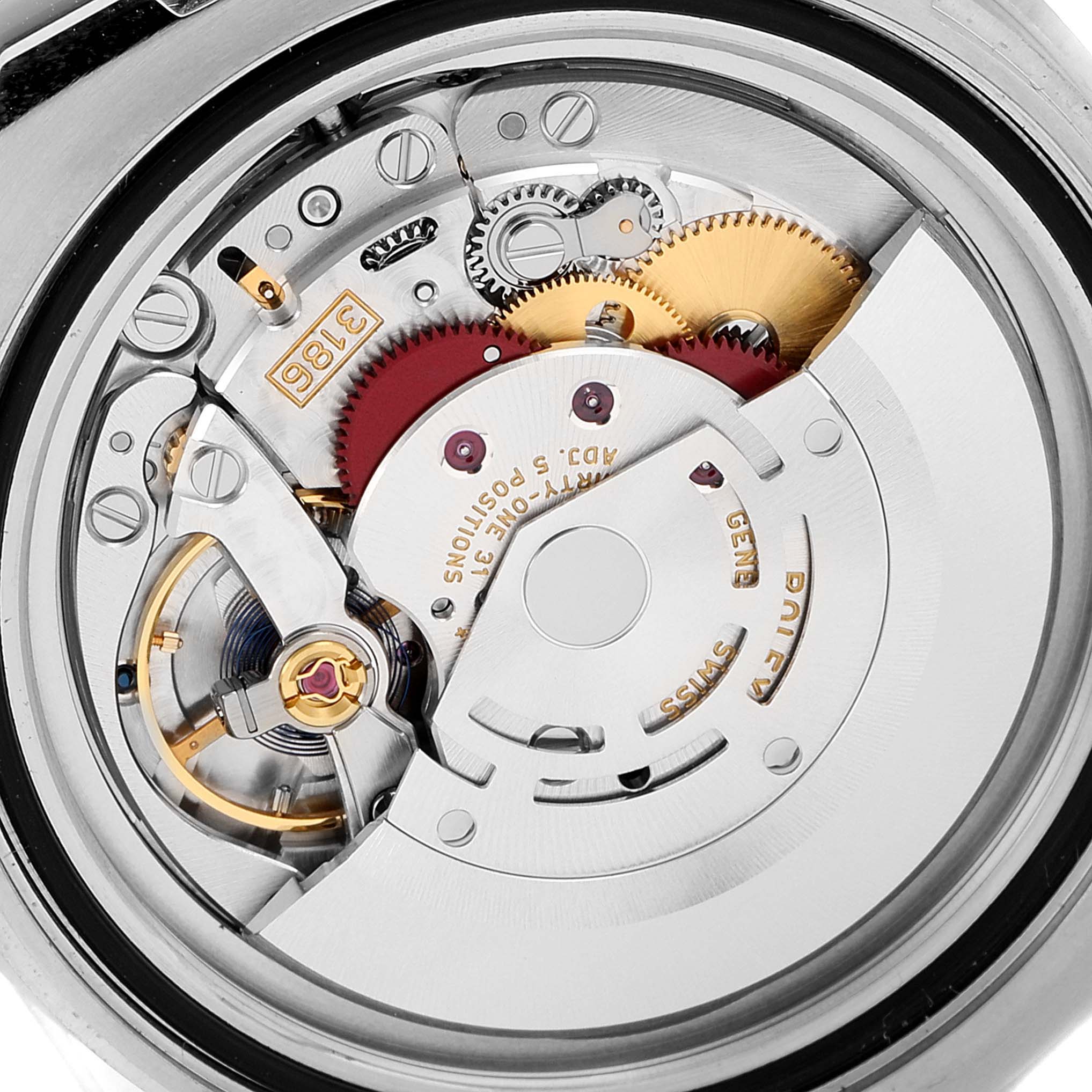 The image shows the internal mechanism of a Rolex GMT-Master 116710 Men
s Stainless Steel Black Dial 116710 Men
s Stainless Steel Black Dial, viewed from the back, revealing gears and components of the movement.