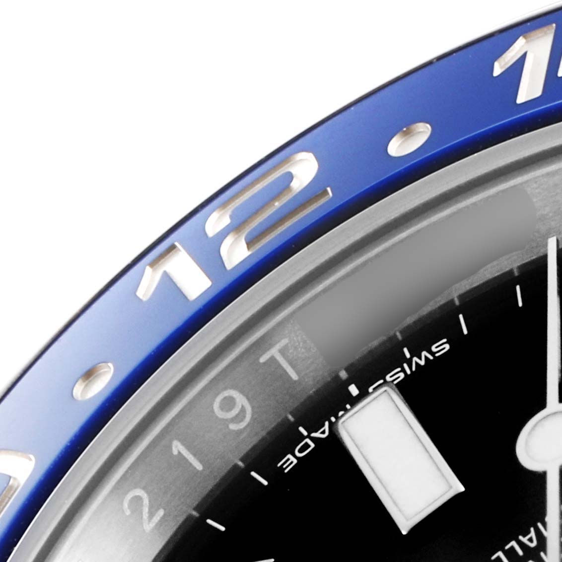 This close-up image of the Rolex GMT-Master 116710 Men
s Stainless Steel Black Dial 116710 Men
s Stainless Steel Black Dial watch shows part of the blue bezel, dial, and hour markers.