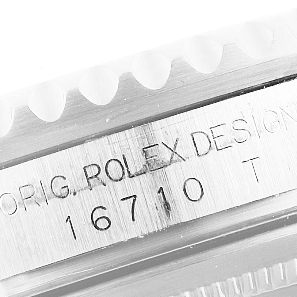 This image shows a close-up of the case side of a Rolex GMT-Master 16710 Men's Stainless Steel Black Dial 16710 Men's Stainless Steel Black Dial model, featuring the "ORIG. ROLEX DESIGN" engraving and model number 16710.