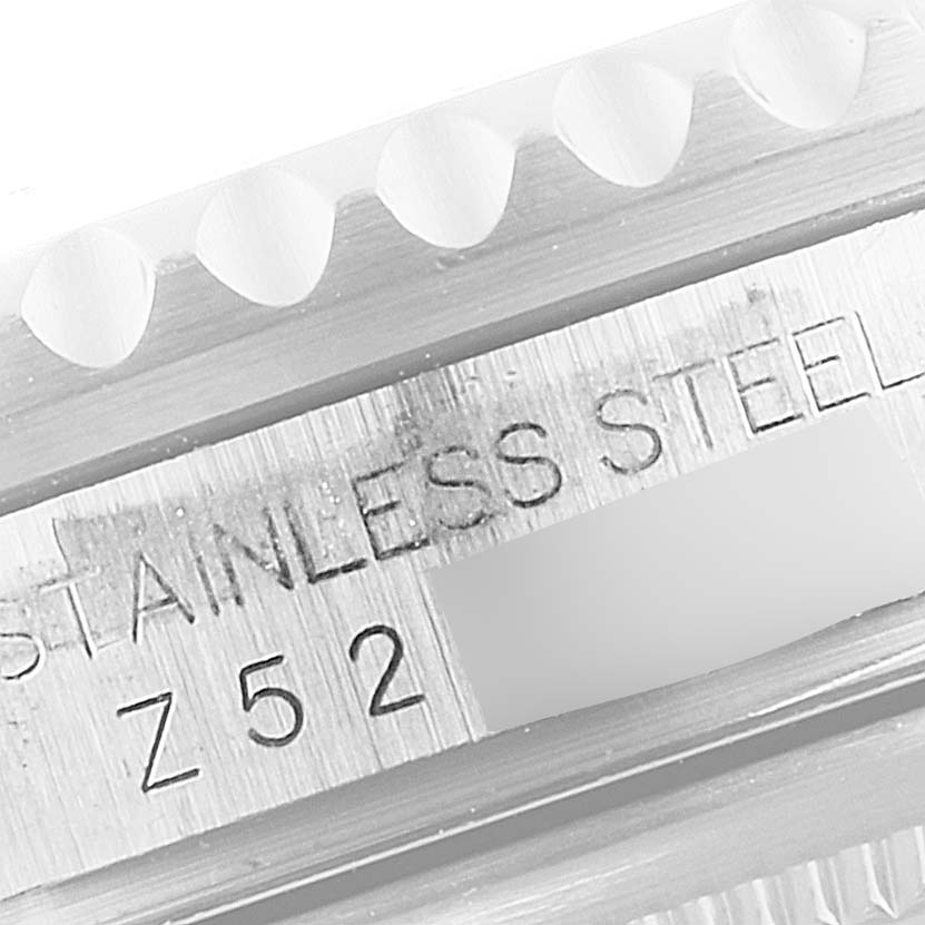 This close-up image shows the inner stainless-steel watchcase and bezel edge of a Rolex GMT-Master 16710 Men's Stainless Steel Black Dial 16710 Men's Stainless Steel Black Dial.