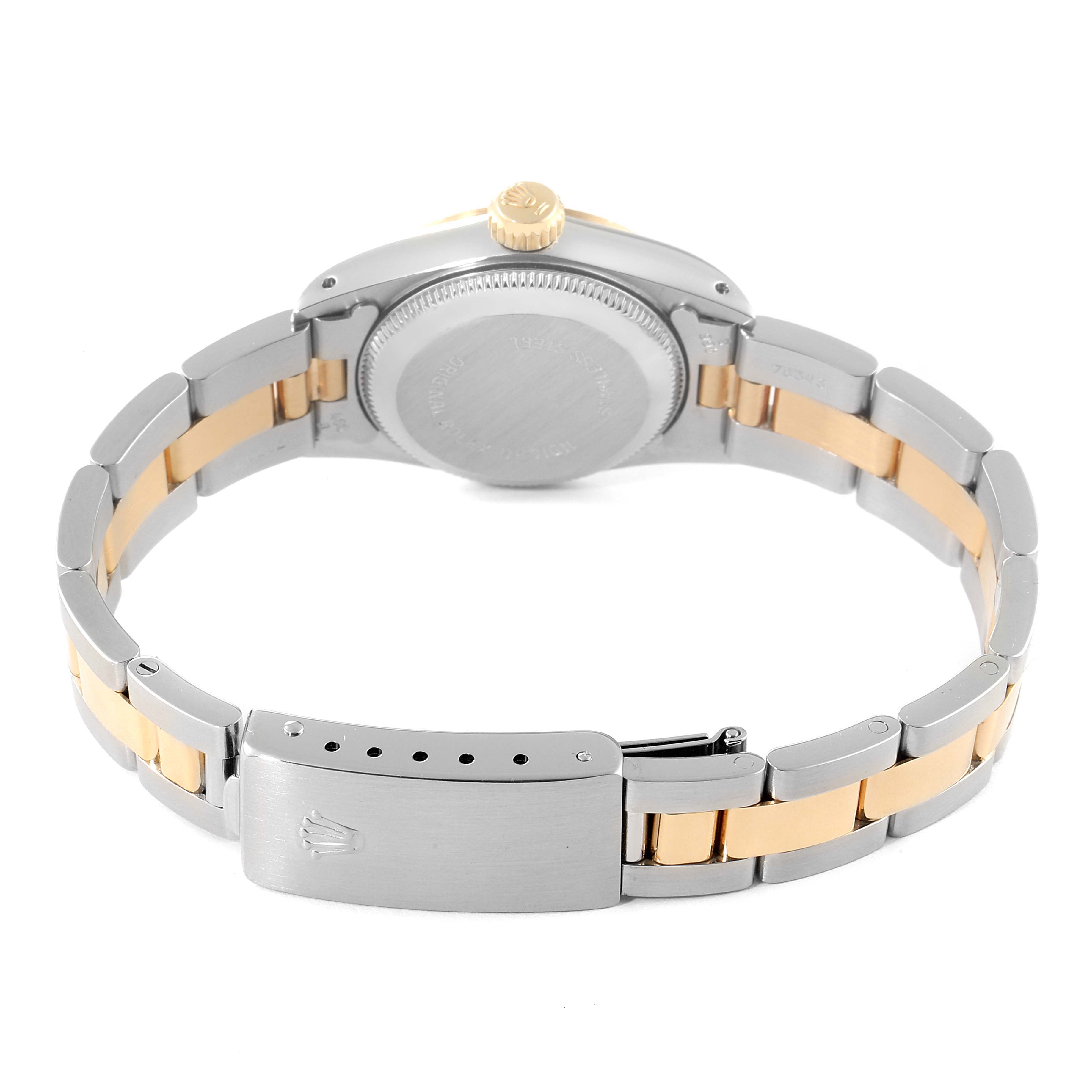 This image shows the back case, crown, and clasp of a Rolex Oyster Perpetual 67243 Women's Steel and Gold (two tone) Silver Dial 67243 Women's Steel and Gold (two tone) Silver Dial watch with a two-tone metal bracelet.