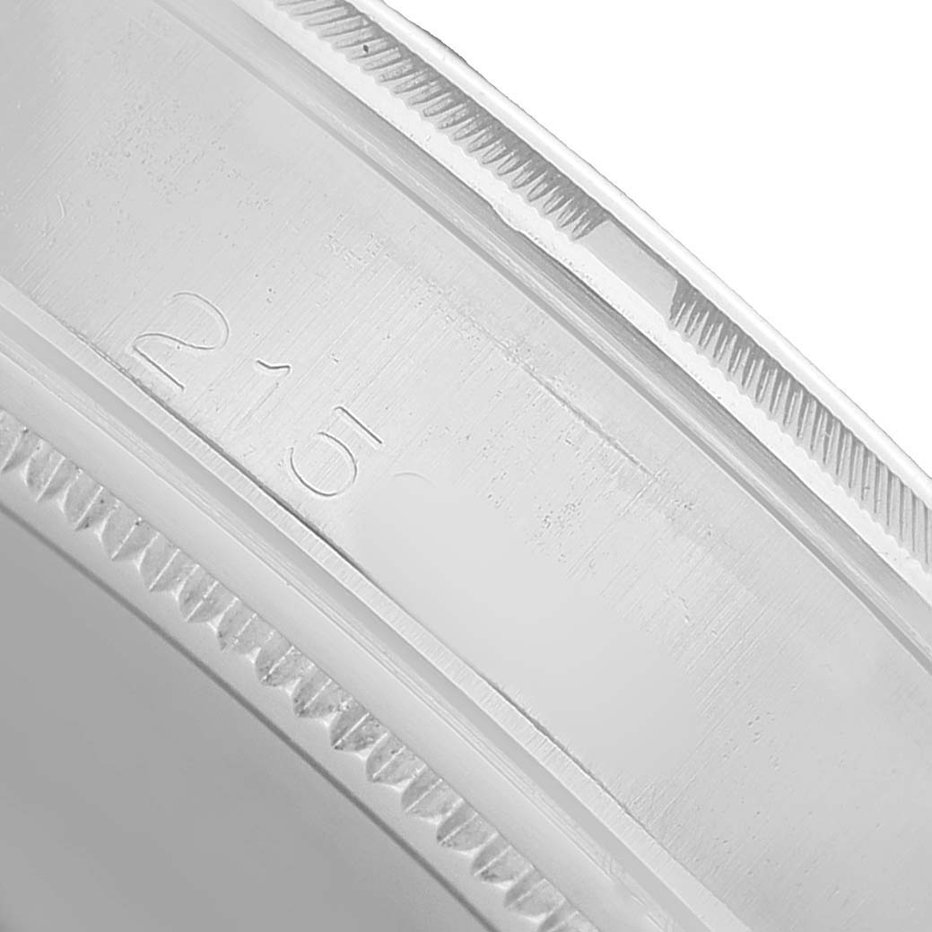 The image shows a close-up of the side of the case with engraved markings on a Rolex Vintage Collection 6427 Men's Stainless Steel Silver Dial watch.