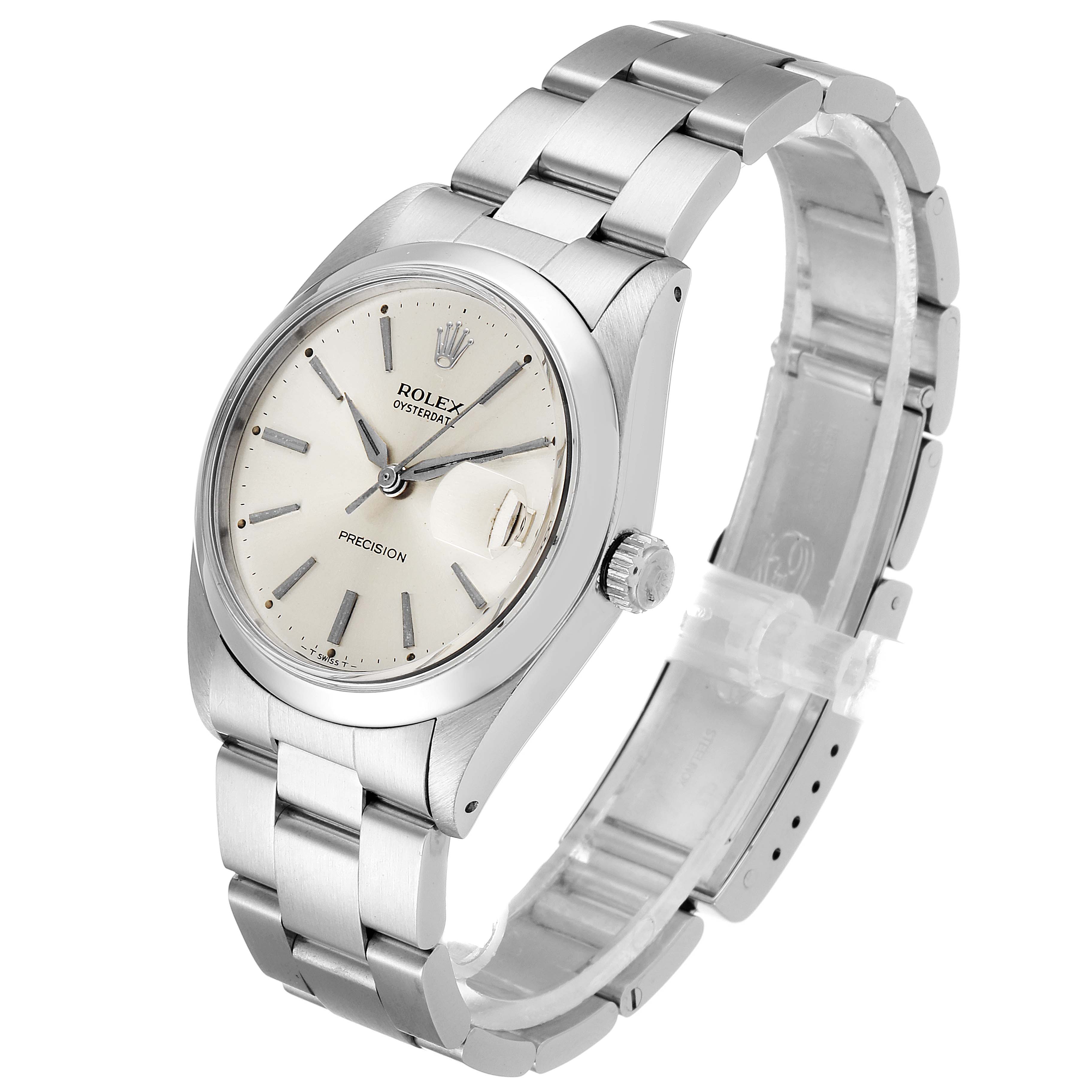 The watch is a Vintage Collection model by Rolex, shown from a slight angle displaying the face, bezel, crown, and part of the bracelet.